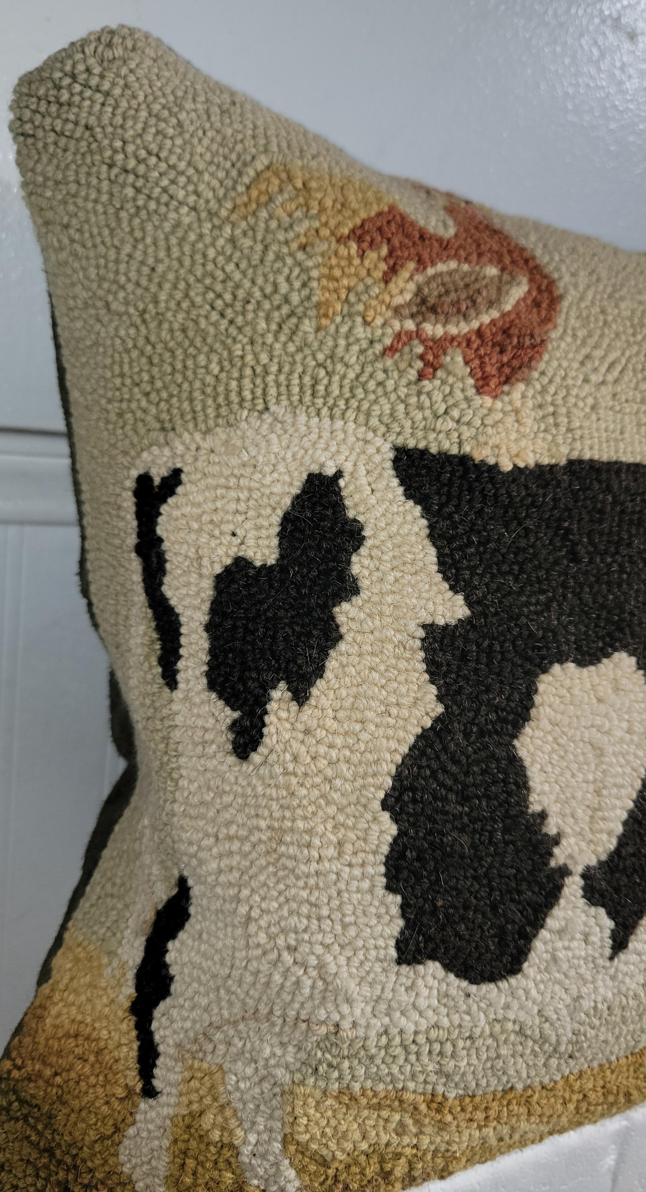 Hand hooked cow pillow with suede / leather backing.The insert is down & feather fill.