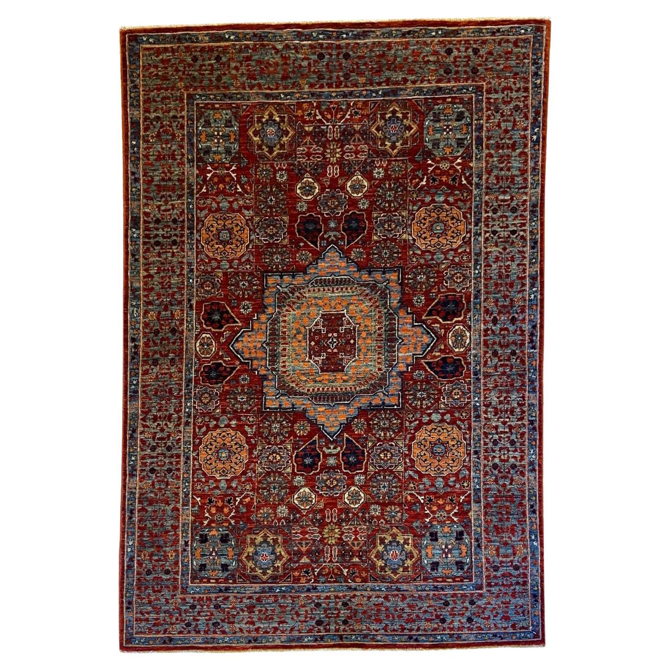 Tapis afghan 4' x 6' noué à la main avec motif de médaillon en laine rouge et indigo en vente
