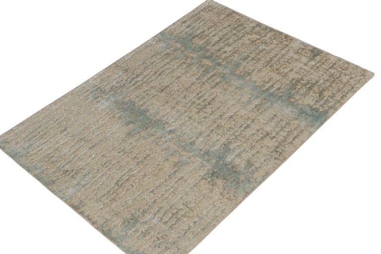 Hand-knotted in finely woven wool & silk, a 3x5 abstract rug from Rug & Kilim’s contemporary selections. The marriage of neutrals and cool blue sheen tones plays beautifully with the high low pile for a healthy lustrous appeal. Unusual to find an