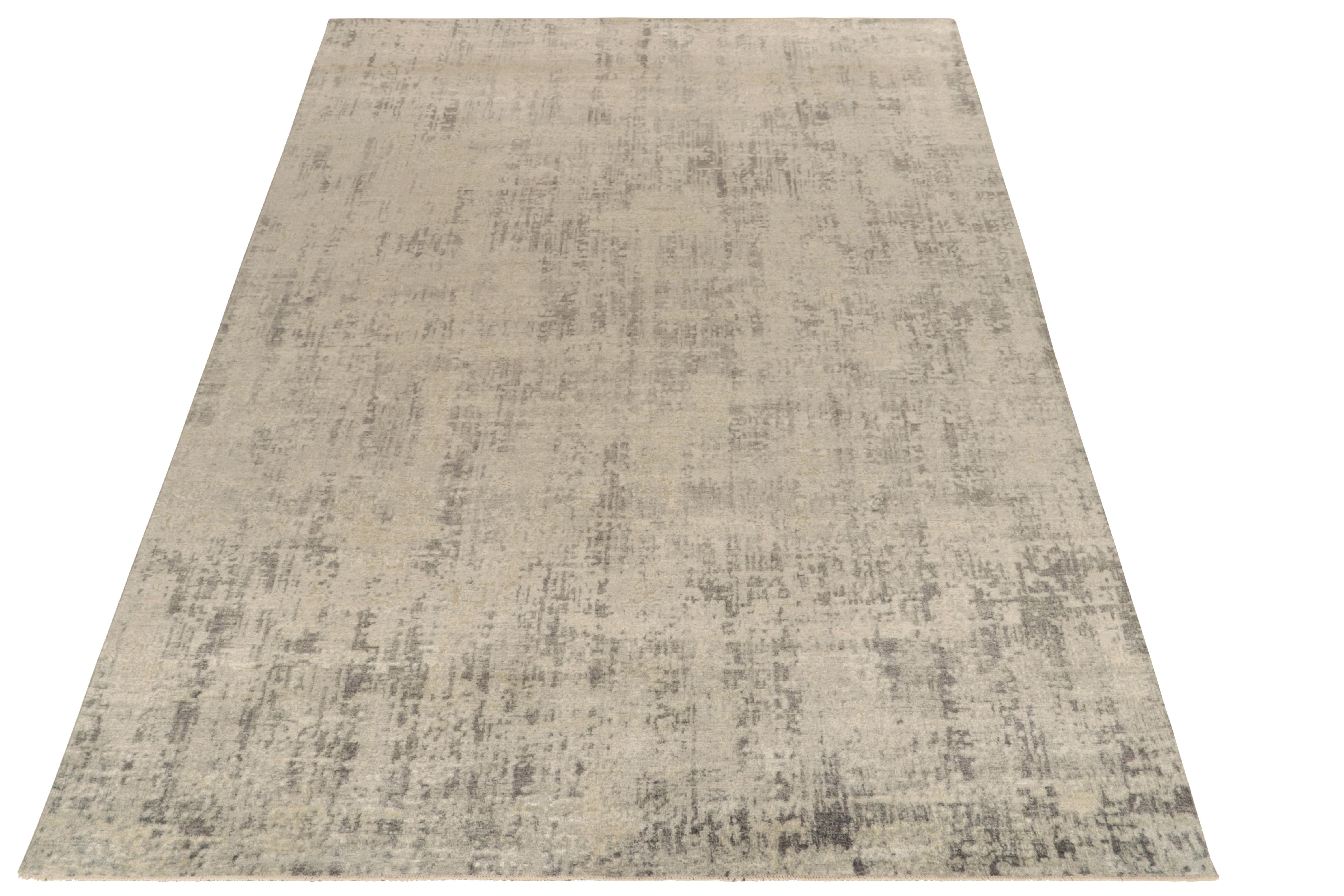 This 9×12 abstract rug is a bold new addition to Rug & Kilim’s Modern Collection. Hand-knotted in wool and silk, it enjoys finely detailed greige and taupe striae in its all over pattern.

Keen eyes may further admire the meticulous detail in its