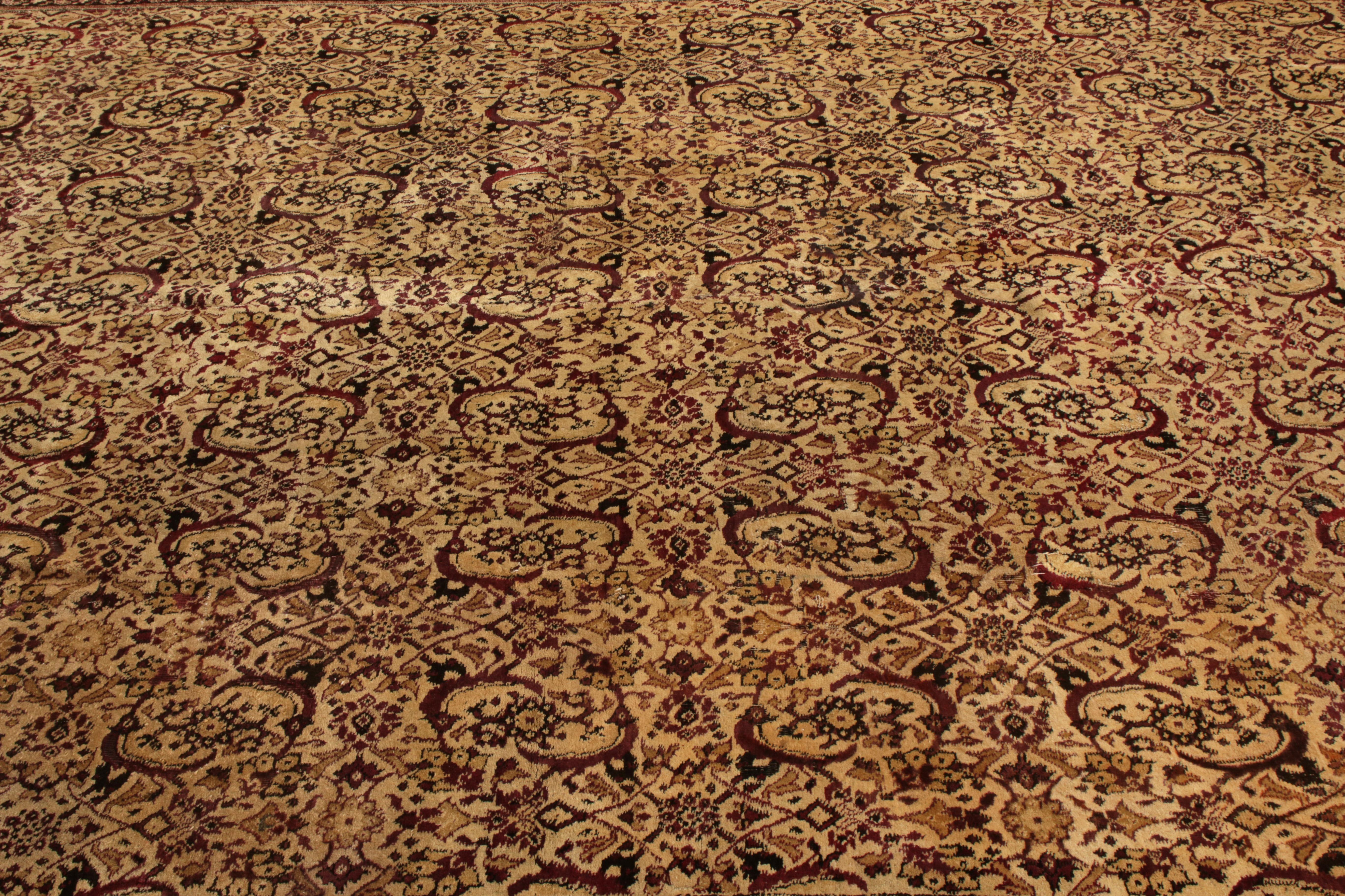 Hand knotted in wool originating from India circa 1880-1890, this 12 x 18 antique rug represents a rare large-size Agra rug of further exceptional color and refined pattern—revered among the most sought-after Classic rug families seldom enjoying