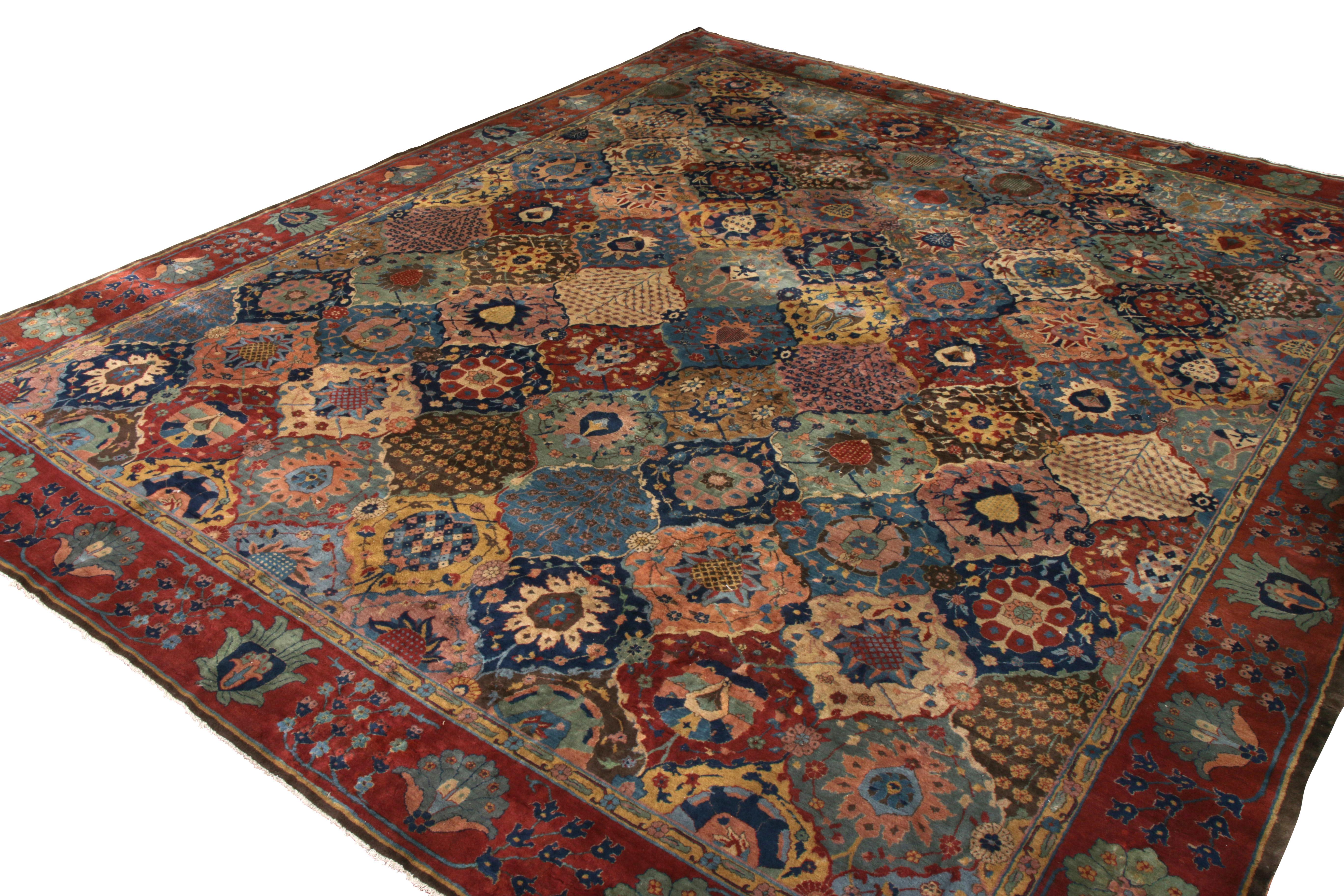 Hand-knotted antique Agra rug in blue and red floral pattern.
Description: Hand knotted in wool originating from India circa 1900-1910, this 15 x 18 antique rug connotes a transitional Agra rug of a notably rare design, enjoying a beautifully