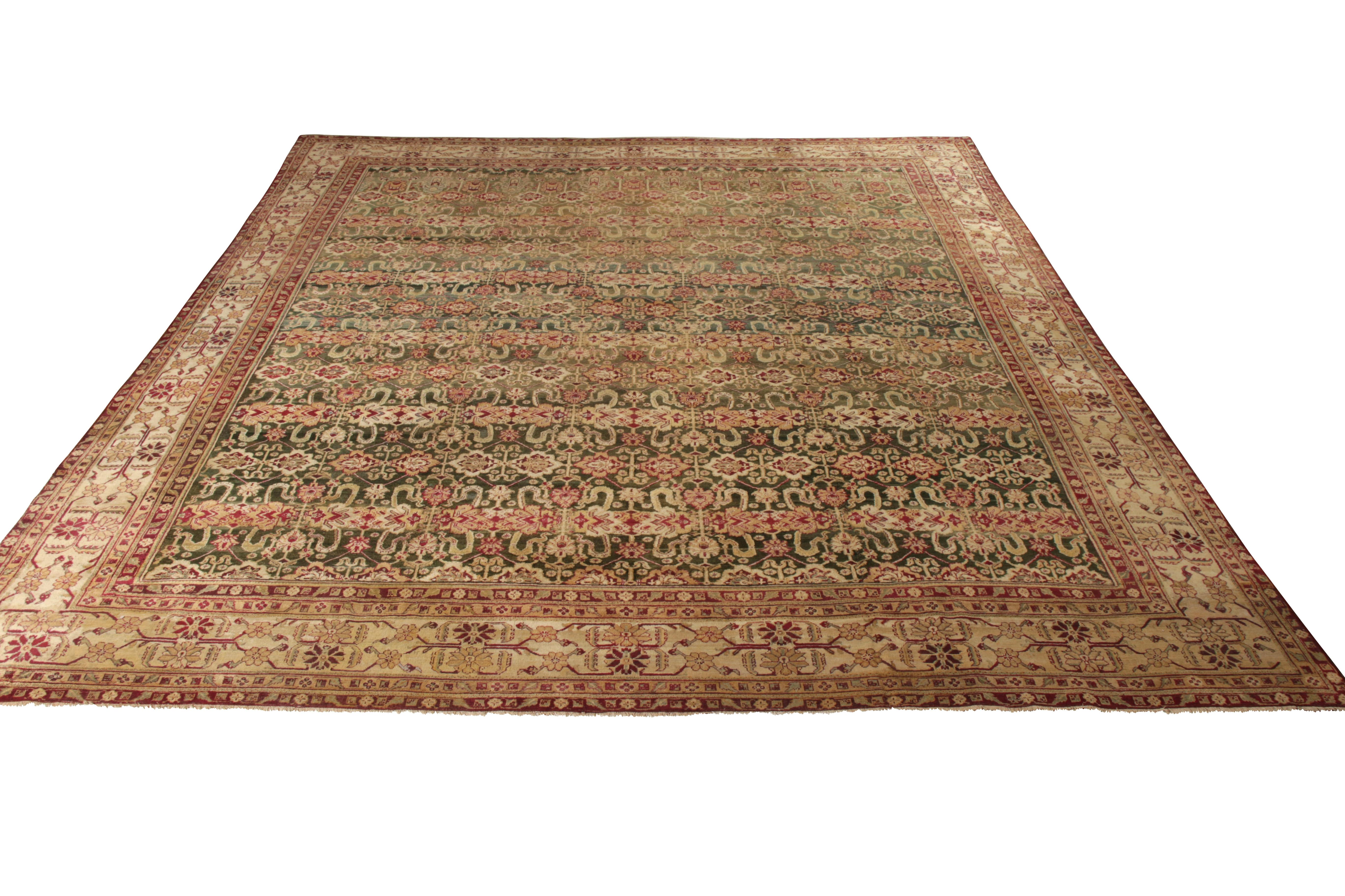 Hand knotted in wool originating from India circa 1870-1880, this 13 x 14 antique rug connotes a traditional Agra rug design enjoying a subtle European influence in the hypnotic, intricate field repetition and the subtle variation of warm and rich