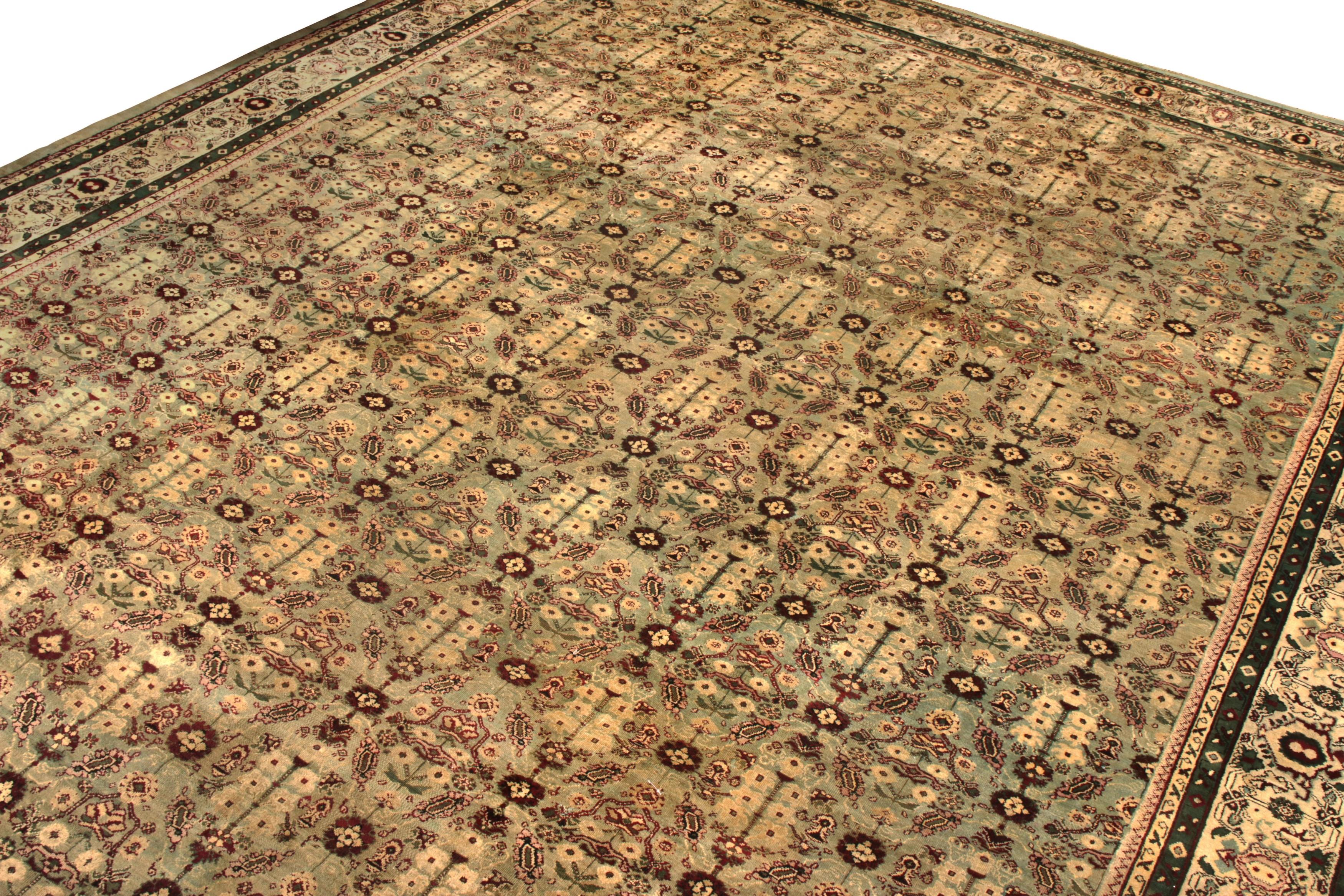Enjoying a large 14x21 scale, this antique Amritsar rug is a splendid addition to Rug & Kilim’s coveted Antique & Vintage collection. Characterised by an interesting all over geometric-floral style, the pattern transitions gracefully in a phenomenal