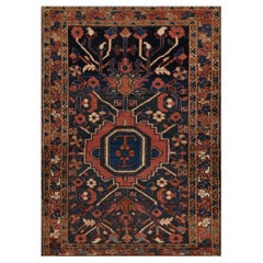 Tappeto Heriz floreale in lana annodato a mano, risalente al 1900 circa.