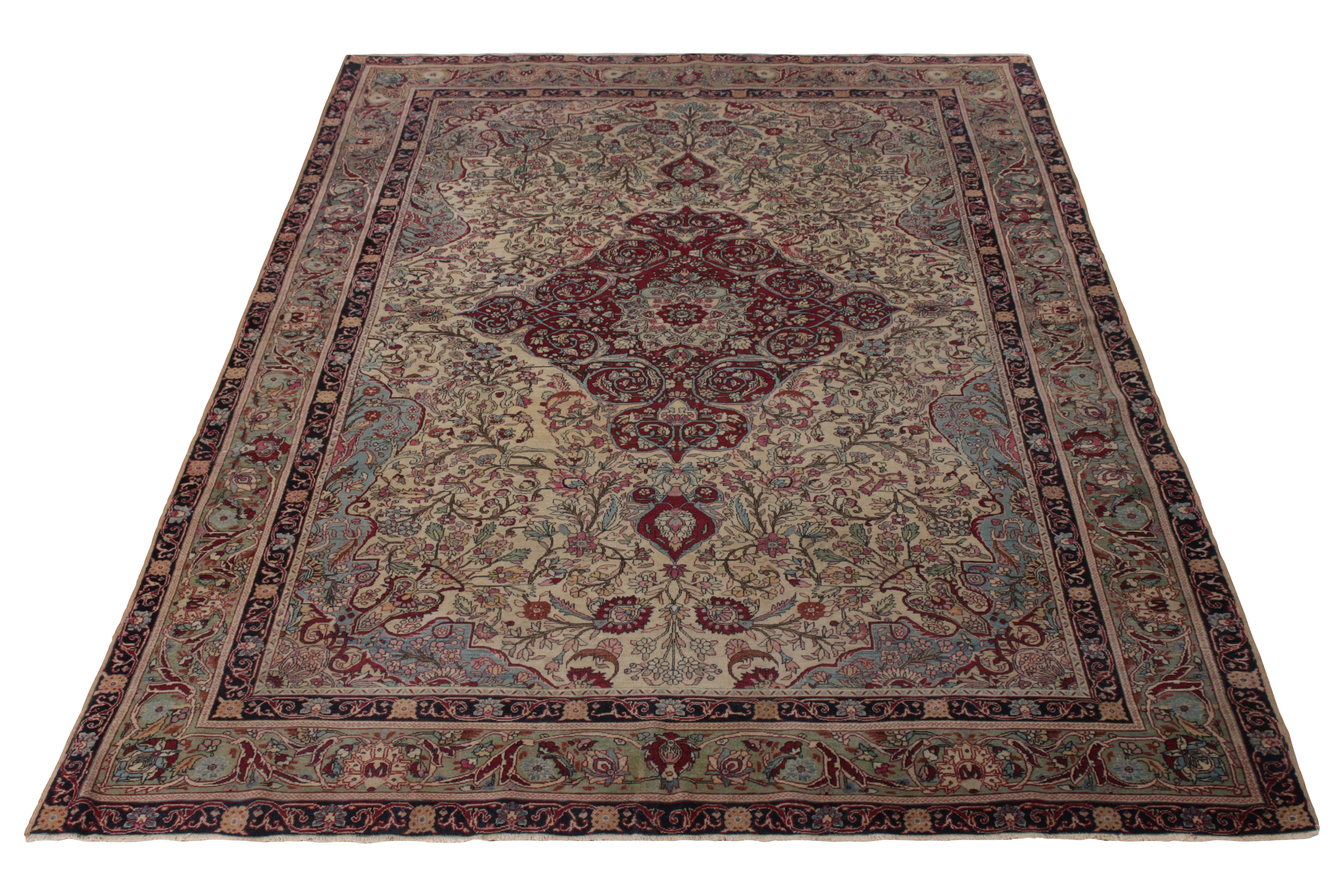 A 6x11 antique Persian rug of Isfahan origin, employing blue, red, and beige in hand-knotted wool originating circa 1920-1930. 

On the design: The play of burgundy and blue enjoys fabulous depth in marrying medallion and islimi patterns of