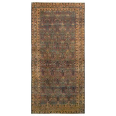 Handgeknüpfter antiker Kerman-Perserteppich mit blau-braunem Blumenmuster von Teppich & Kelim