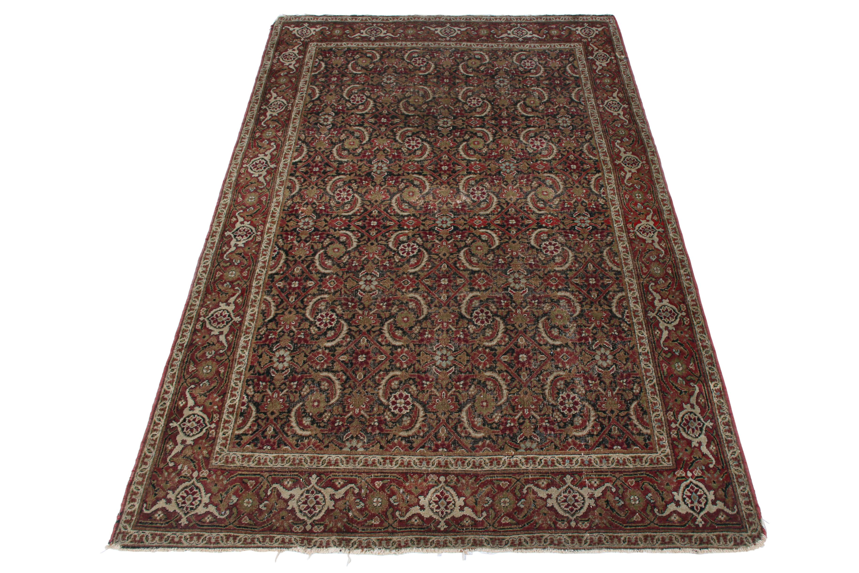 Hand knotted in wool originating from the titular Persian region circa 1890-1900, this antique Kerman Lavar rug enjoys a distinguished marriage between sought-after, exceptionally rich colorway and a celebrated classic pattern. The play of this