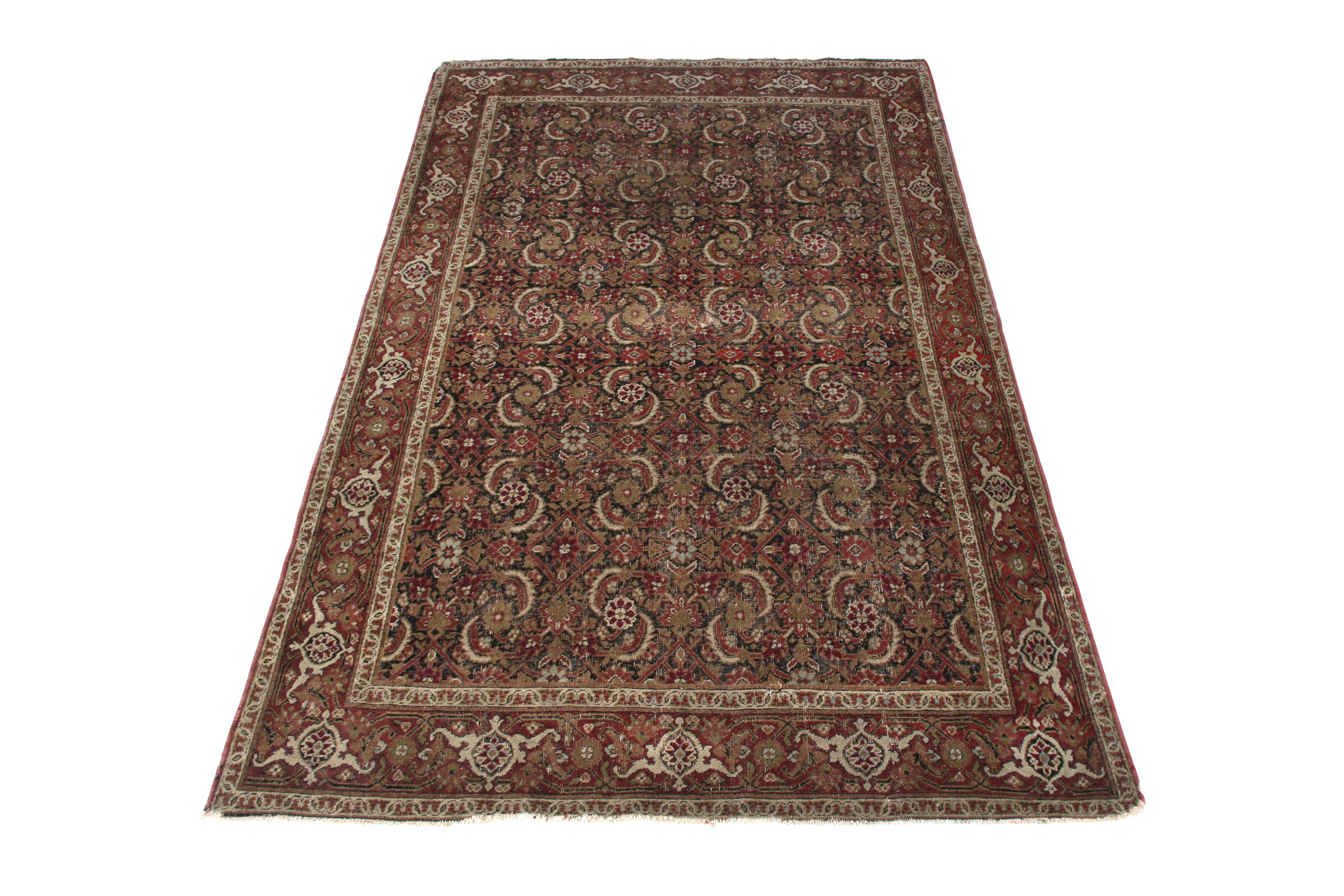 Hand knotted in wool originating from the titular Persian region circa 1890-1900, this antique Kerman Lavar rug enjoys a distinguished marriage between sought-after, exceptionally rich colorway and a celebrated classic pattern. The play of this