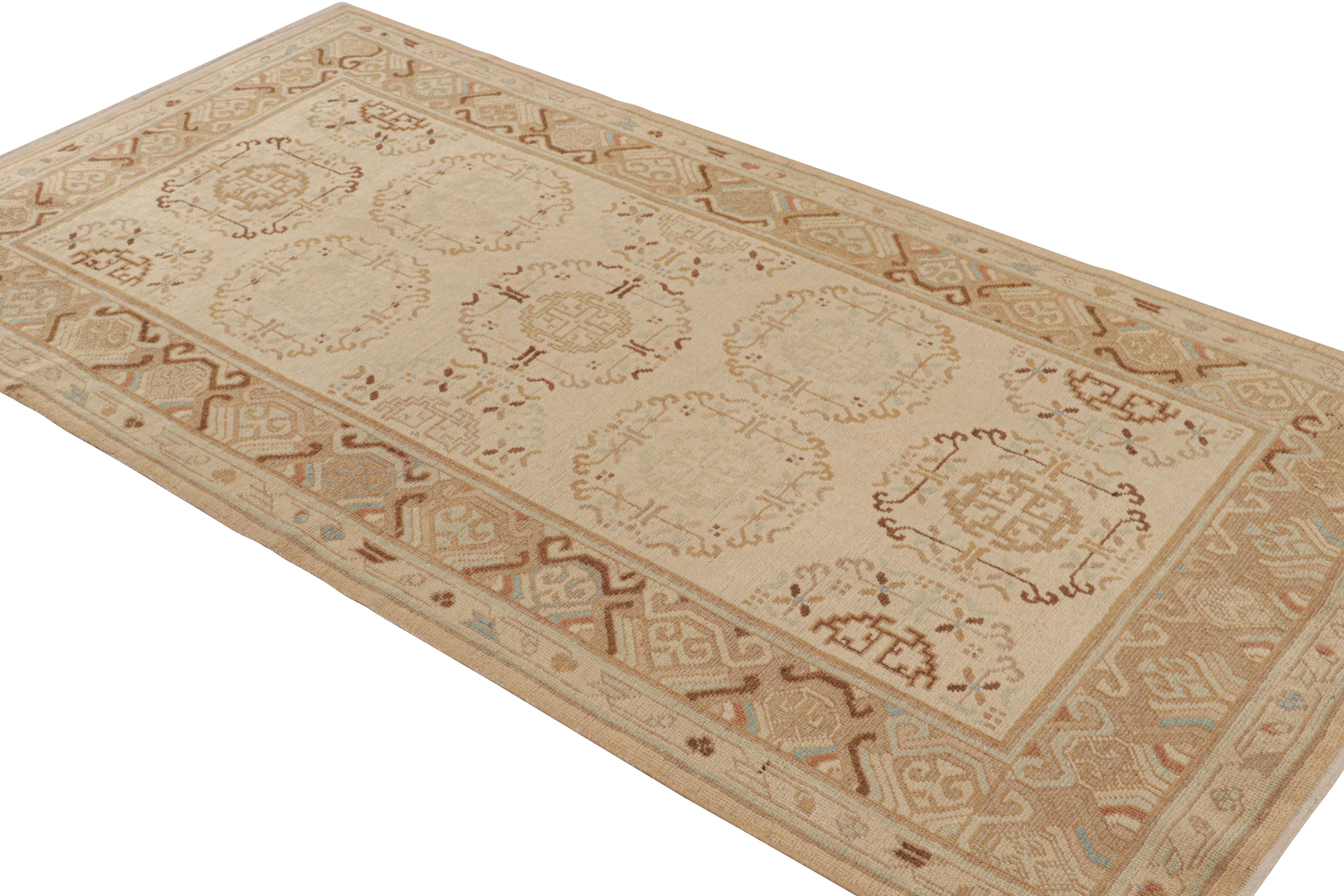 An antique 4 x 8 Khotan rug of a rare green background, playing with beige-brown in classic medallion patterns. A transitional design and celebrated pattern, hand knotted in a low-pile wool, originating from East Turkestan, circa