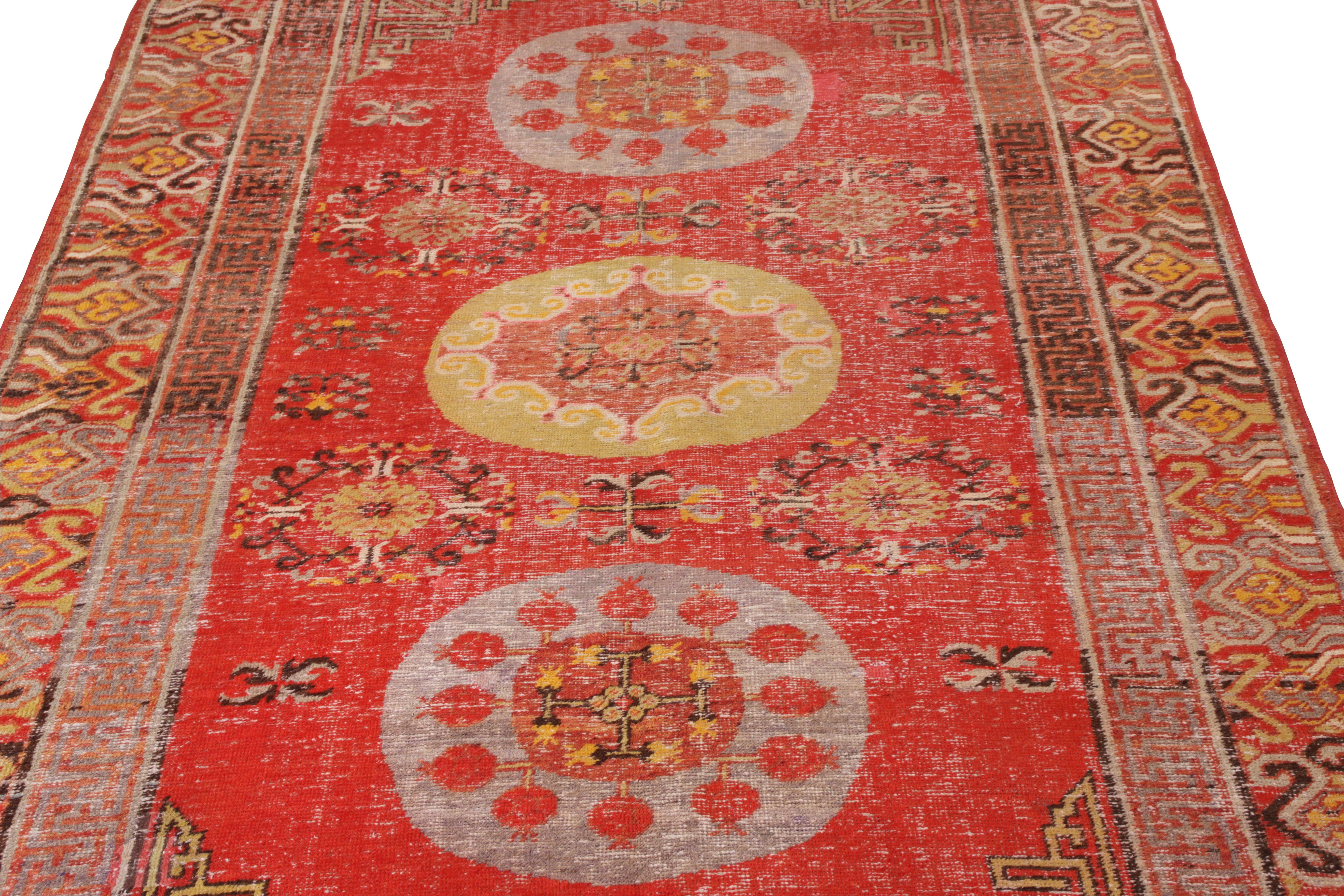 East Turkestani Hand-Knotted Antique Khotan Rug in Red and Gold with Medallion Patterns