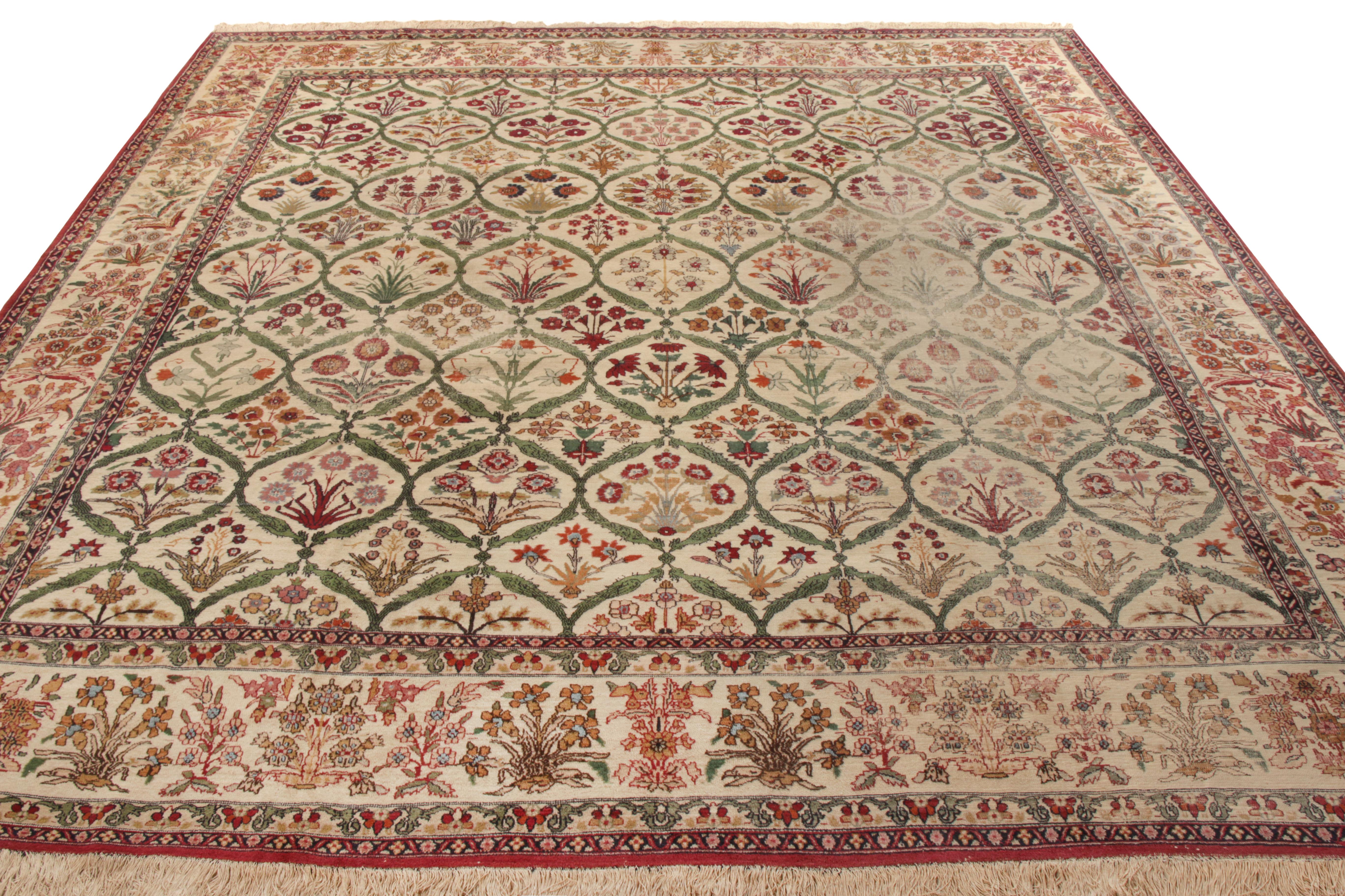 Hand knotted in wool from India circa 1890-1900, this antique 9x15 Indian rug of antique Mogul lineage joins the rare square-sized rugs in our Antique & Vintage Collection. The pattern flourishes in an enticing floral pattern covering the scale in a