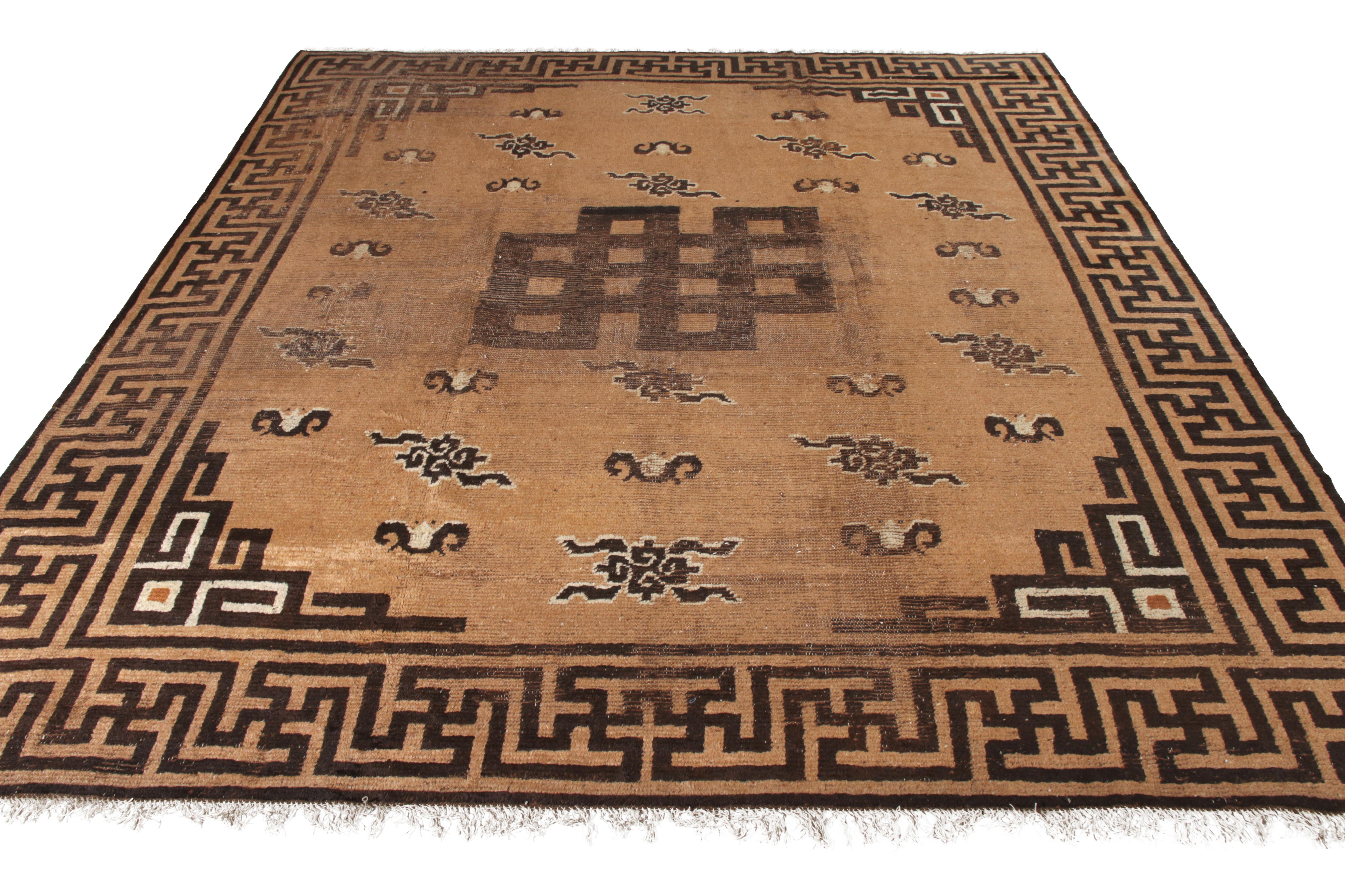 Hand knotted in wool originating circa 1910-1920, this 10 x 11 antique rug connotes a rare Mongolian rug pattern among the select additions to our collection, enjoying a Classic pallet of beige-brown and near-black colorways with engaging oriental