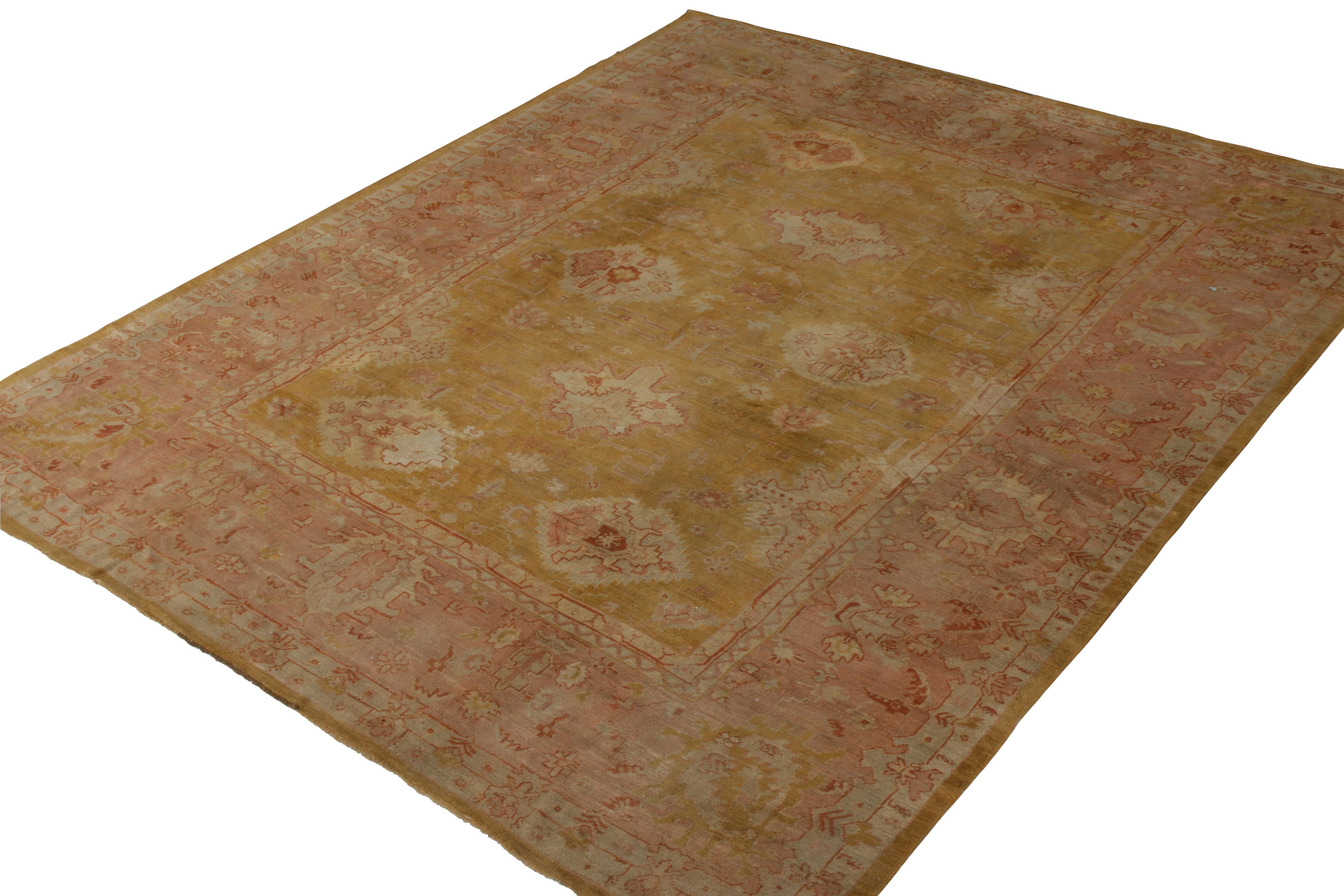 Turkish Hand-Knotted Antique Oushak Rug in Gold and Pink Floral Pattern For Sale