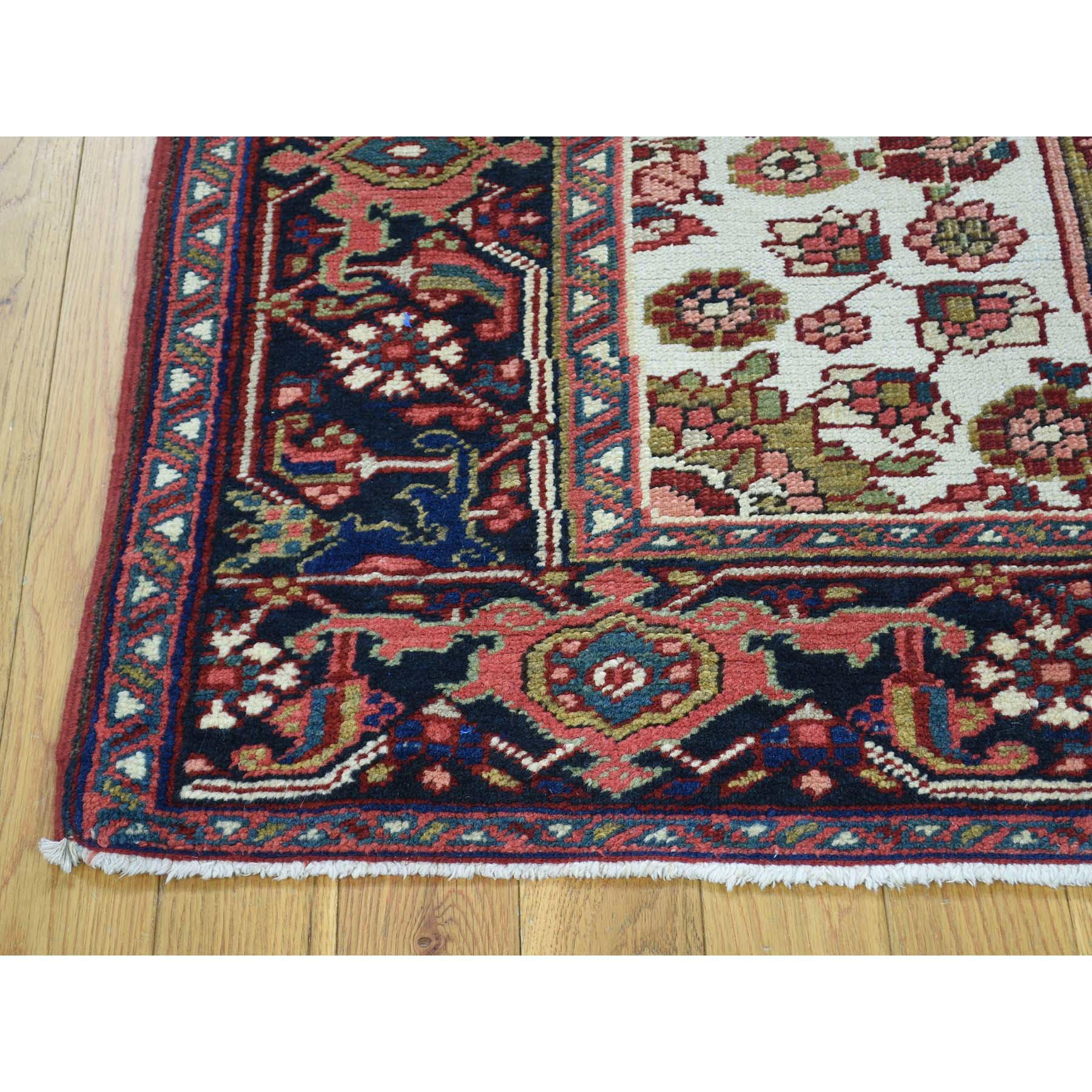This is a truly genuine one-of-a-kind hand knotted antique Persian Heriz mint condition Oriental rug. It has been Knotted for months and months in the centuries-old Persian weaving craftsmanship techniques by expert artisans. Measures: 4'6