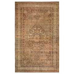 Handgeknüpfter antiker persischer Kermanshah-Teppich mit Medaillonmuster von Teppich & Kelim