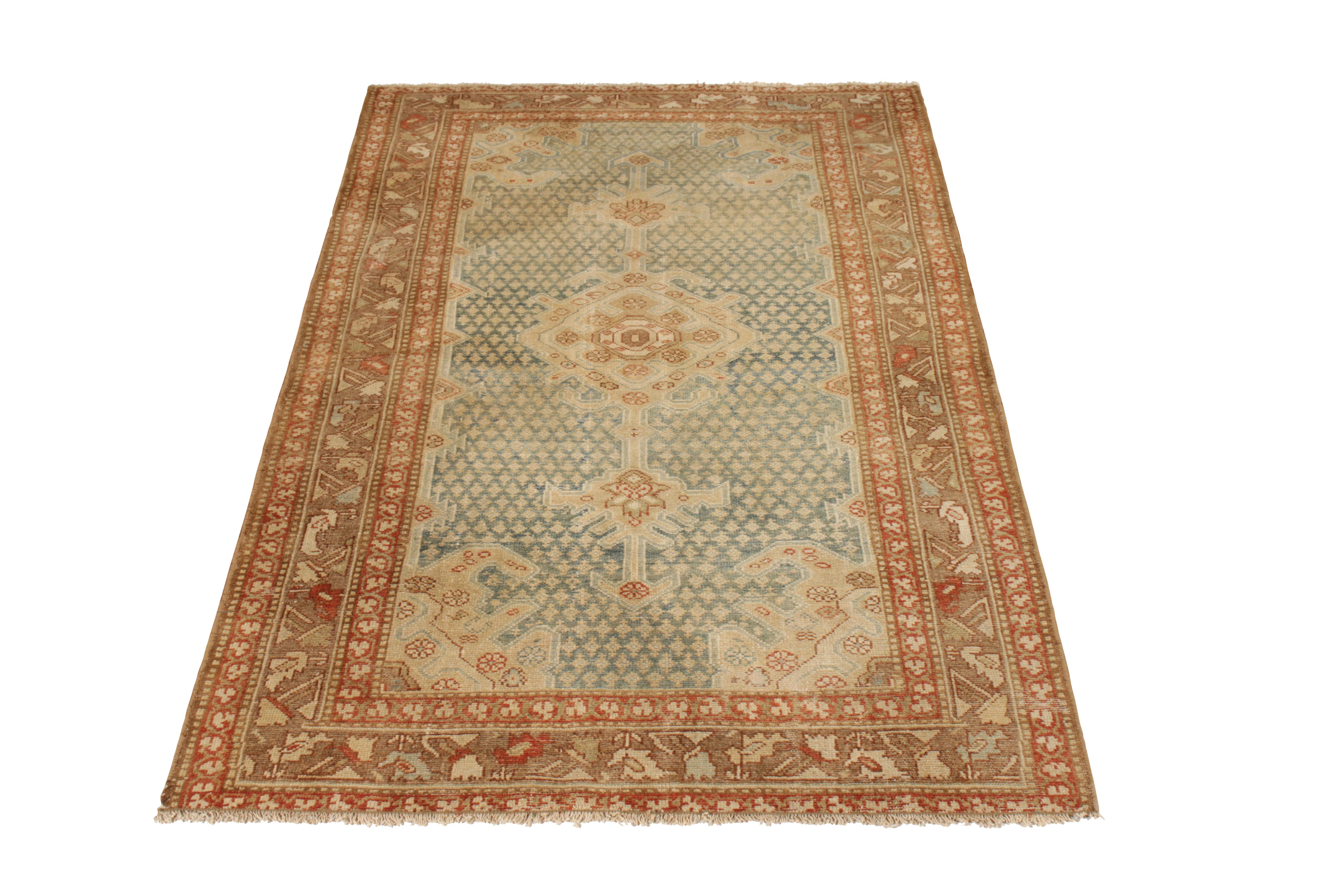 A 3 x 6 antique Persian rug of Malayer design, hand knotted in wool, circa 1920-1930. Enjoying a gorgeous medallion pattern in blue and beige-brown, all in good condition for its age and origin. Well suited in versatile size to entryways, hallways,