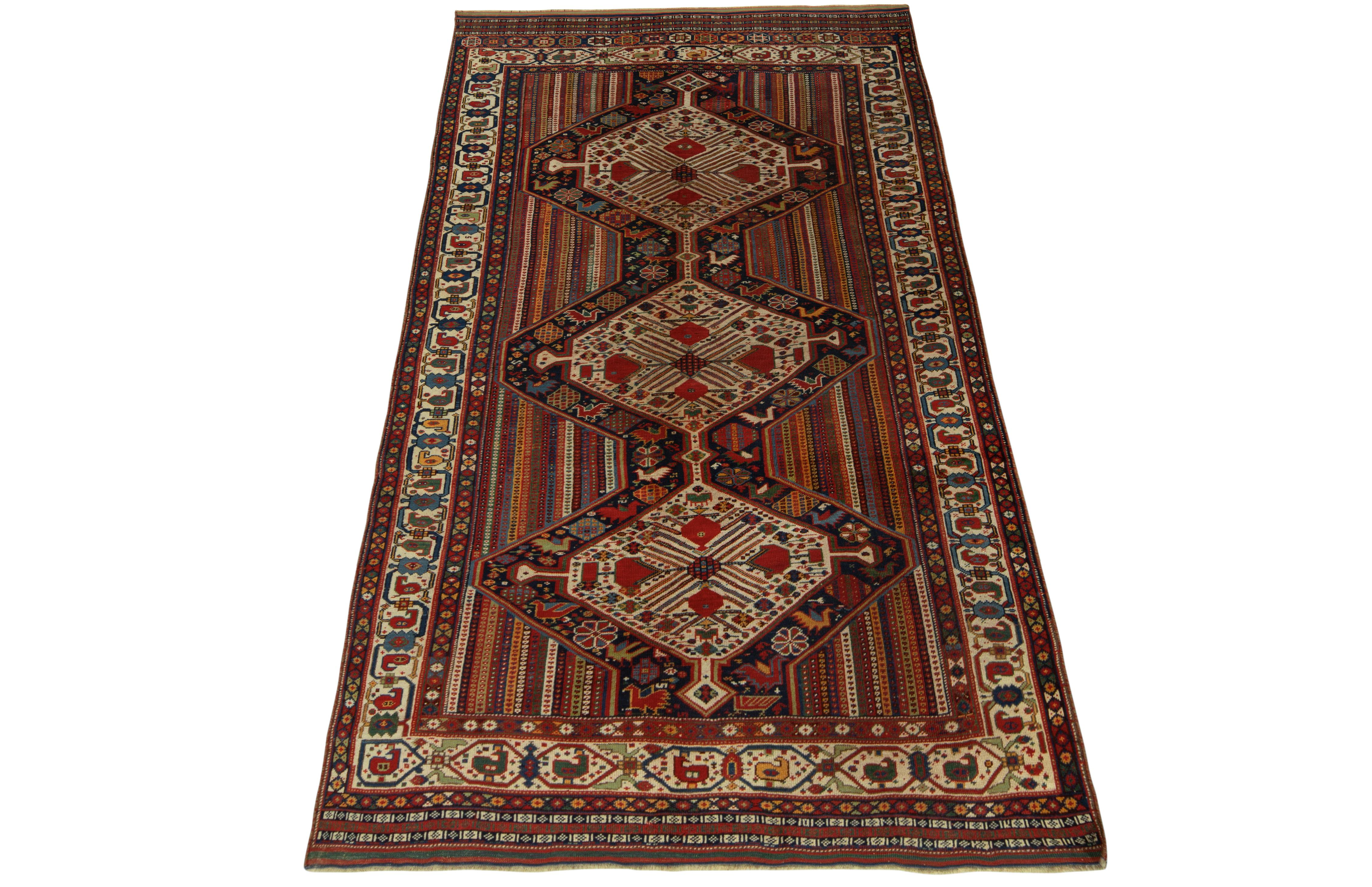 Hand-knotted in fine wool, an antique Qashqai rug from Persia circa 1920-1930 joining Rug & Kilim’s coveted Antique & Vintage collection. Celebrating fine aesthetics of a reputed Iranian workshop, the 5x9 collectible features diamond medallions with