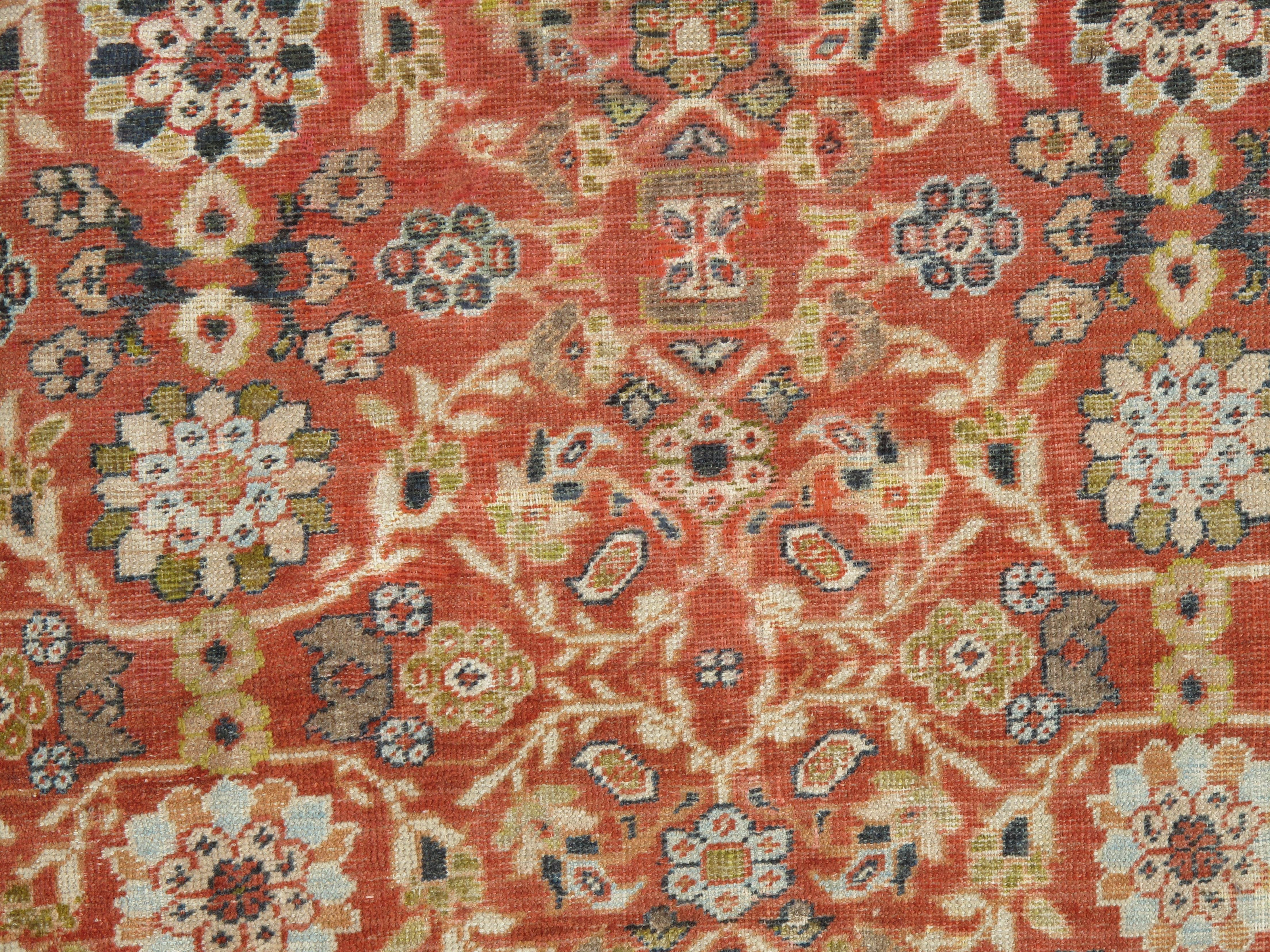 Sultanabad carpets are appreciated for the grand, monumental scale of their design and for the ornamental detail of the floral motifs or palmettes, which all derive from classical Persian prototypes. The scale and detail of this one comes especially