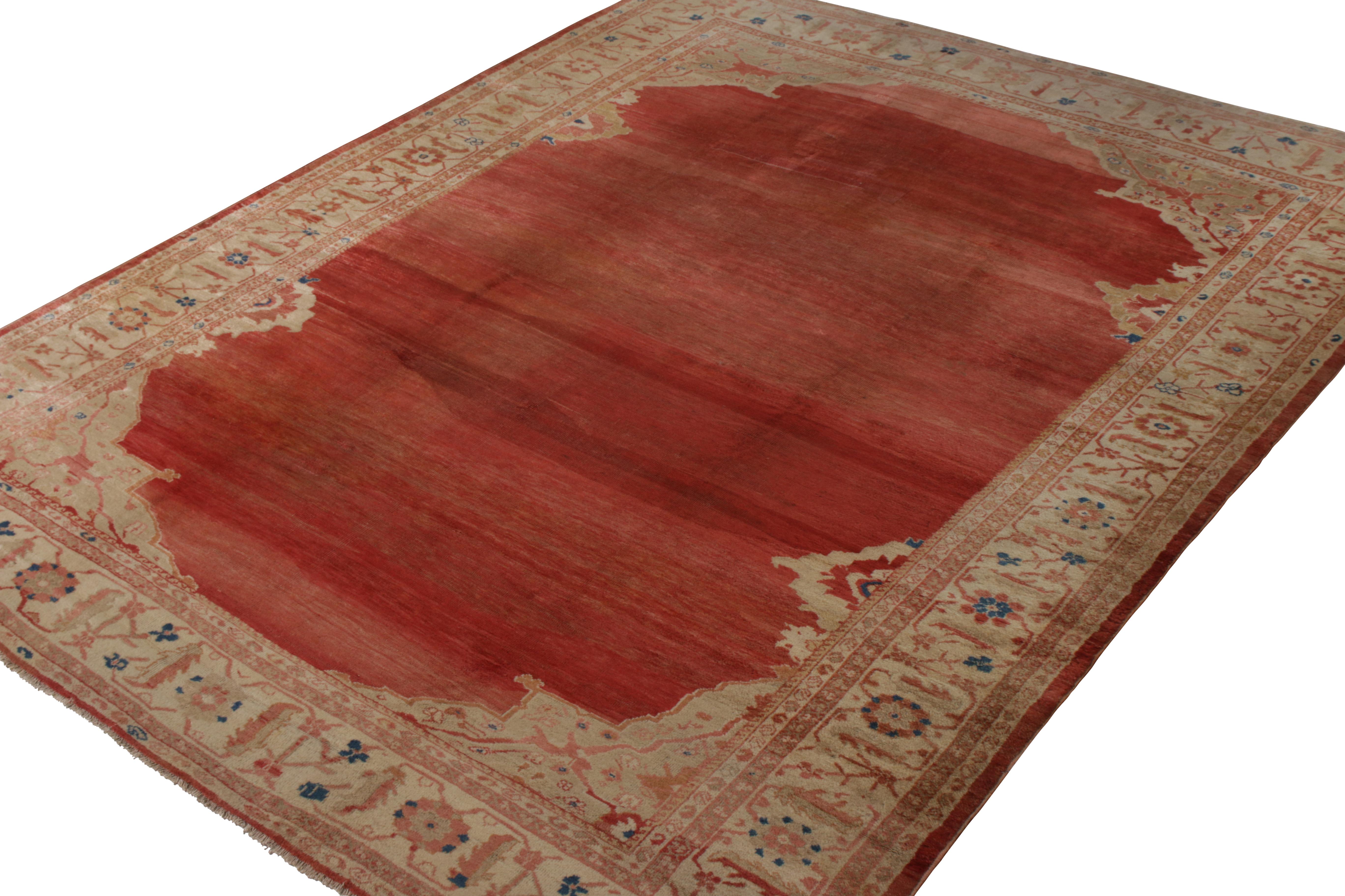 A 10x13 antique Persian rug of Sultanabad origin and rare open-field design in red and beige-brown. Hand knotted in wool circa 1880-1890, enjoying good condition for an antique Sultanabad rug of this age and distinction. 

Further on the design: