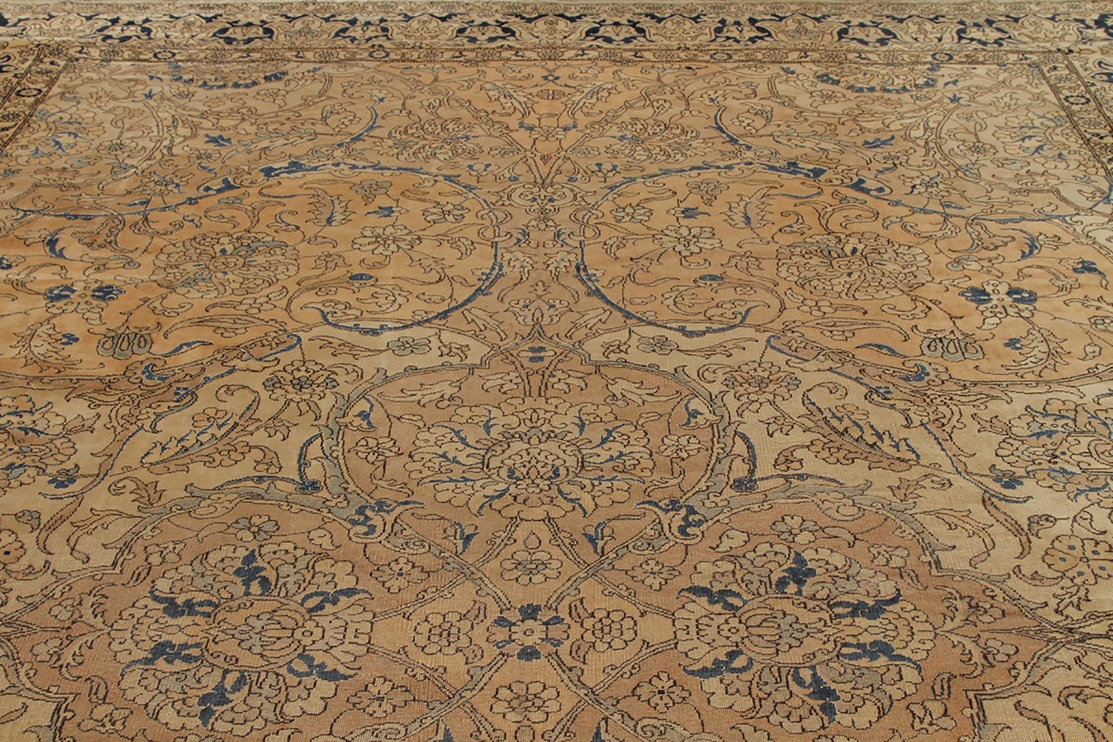 Hand knotted in wool originating from India circa 1890-1900, this 10 x 16 antique rug connotes a transitional Polonaise rug design, both celebrated among the most sought-after lineages of antique Indian rugs and seldom seen in this large size with