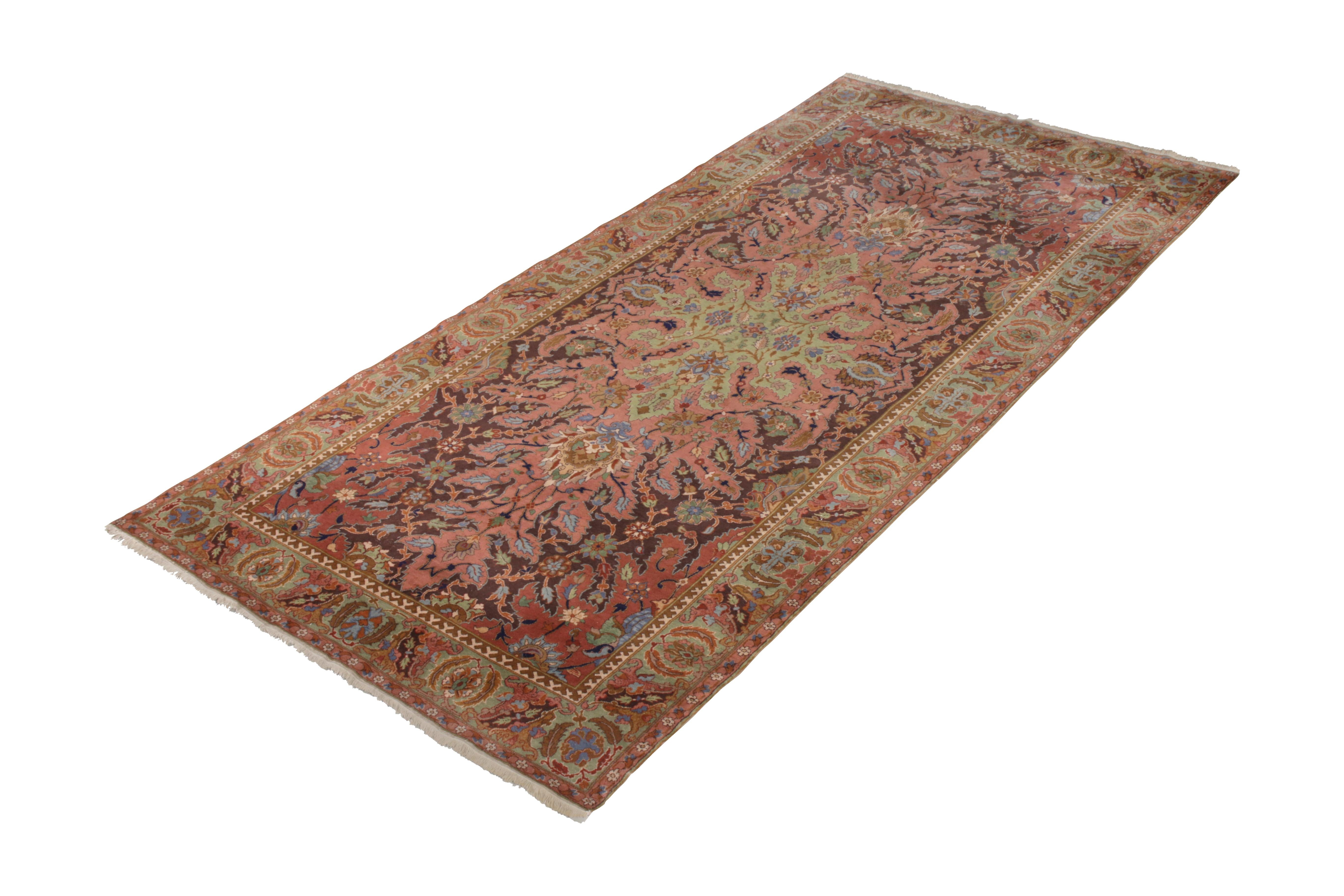 Hand knotted in wool originating from India circa 1910-1920, this spacious 6 x 12 antique rug connotes a rare Polonaise rug design, among the most sought-after lineages of Classic rugs seldom seen in this exceptional condition and vivacious, joyful