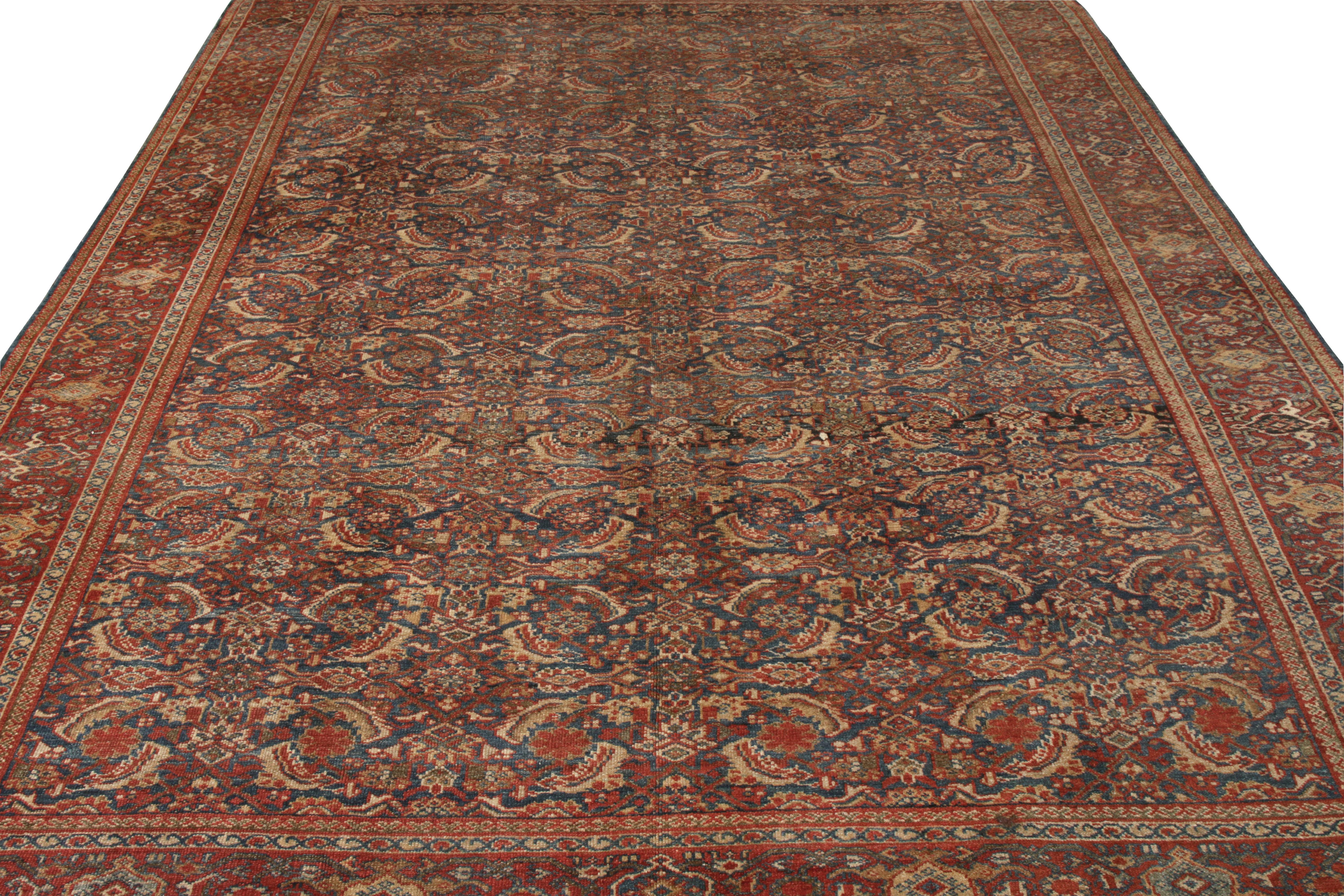 A 9x10 addition to Rug & Kilim’s Antique and Vintage collection. Hand-knotted in wool, this antique Persian Sultanabad rug boasts an all over Herati floral pattern that transitions majestically in red and beige-brown, tastefully punctuated by hues