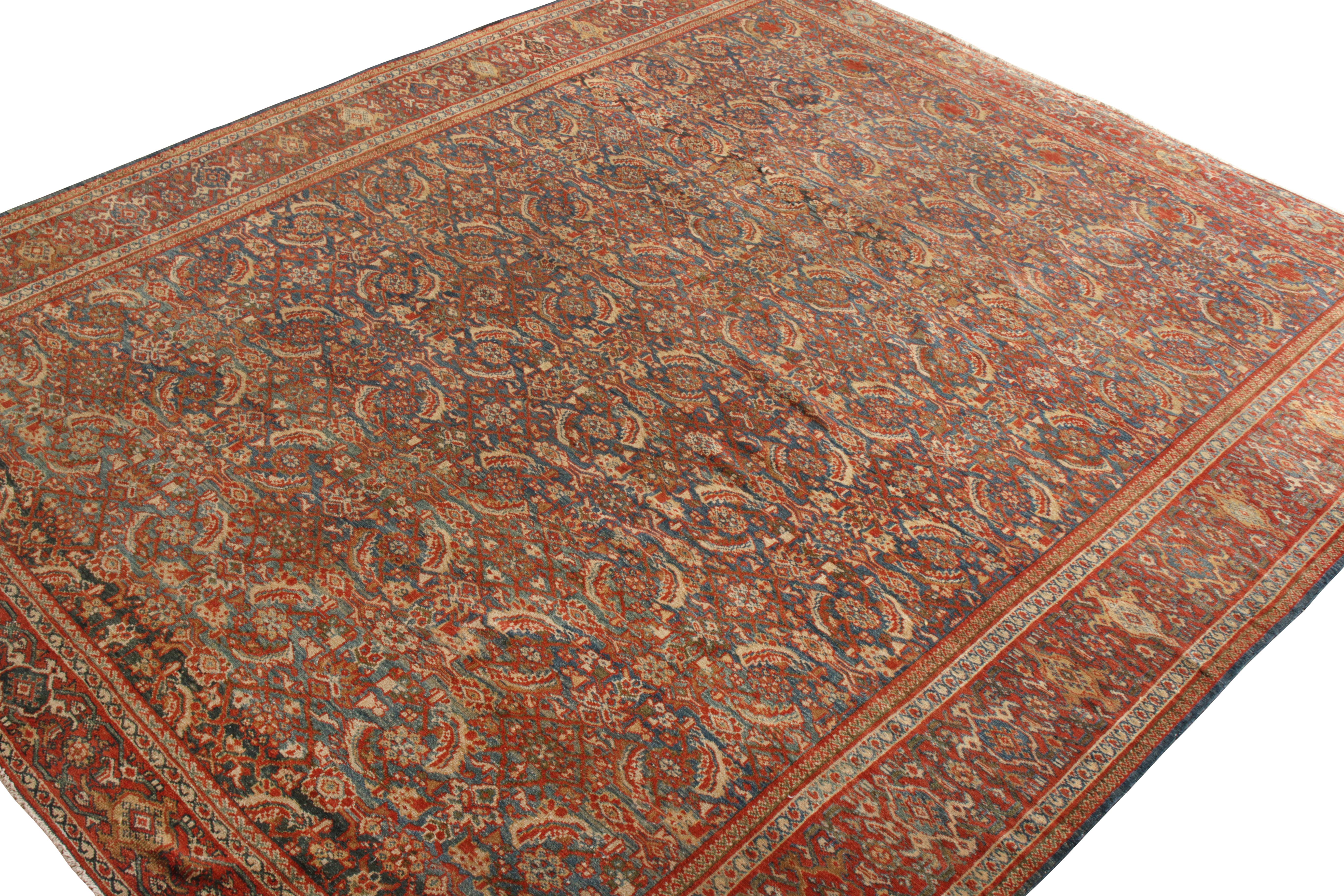 A 9x10 addition to Rug & Kilim’s Antique and Vintage collection. Hand-knotted in wool, this antique Persian Sultanabad rug boasts an all over Herati floral pattern that transitions majestically in red and beige-brown, tastefully punctuated by hues