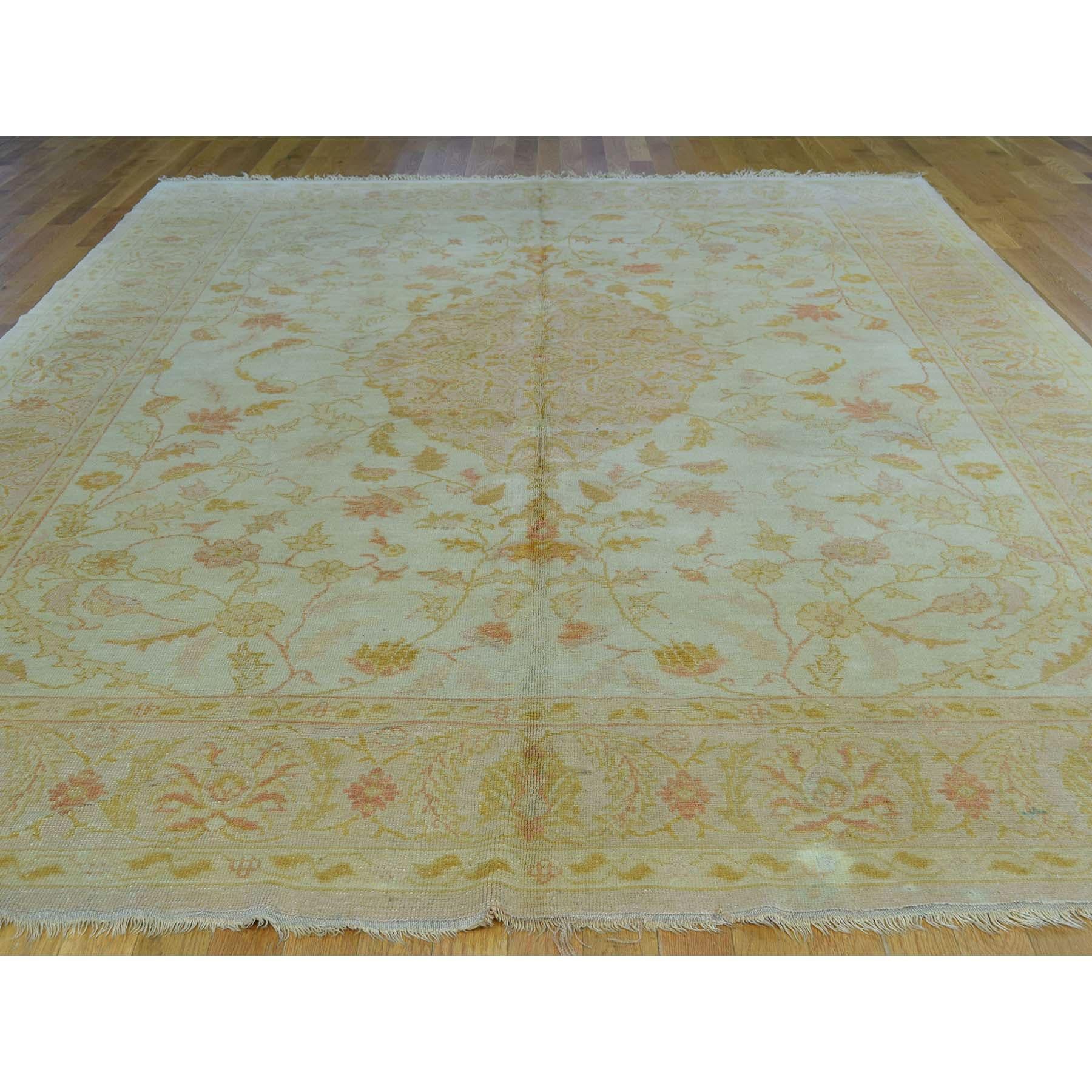 This is a truly genuine one-of-a-kind hand knotted antique Turkish Oushak soft colors oriental rug. It has been Knotted for months and months in the centuries-old Persian weaving craftsmanship techniques by expert artisans. Measures: 8'7