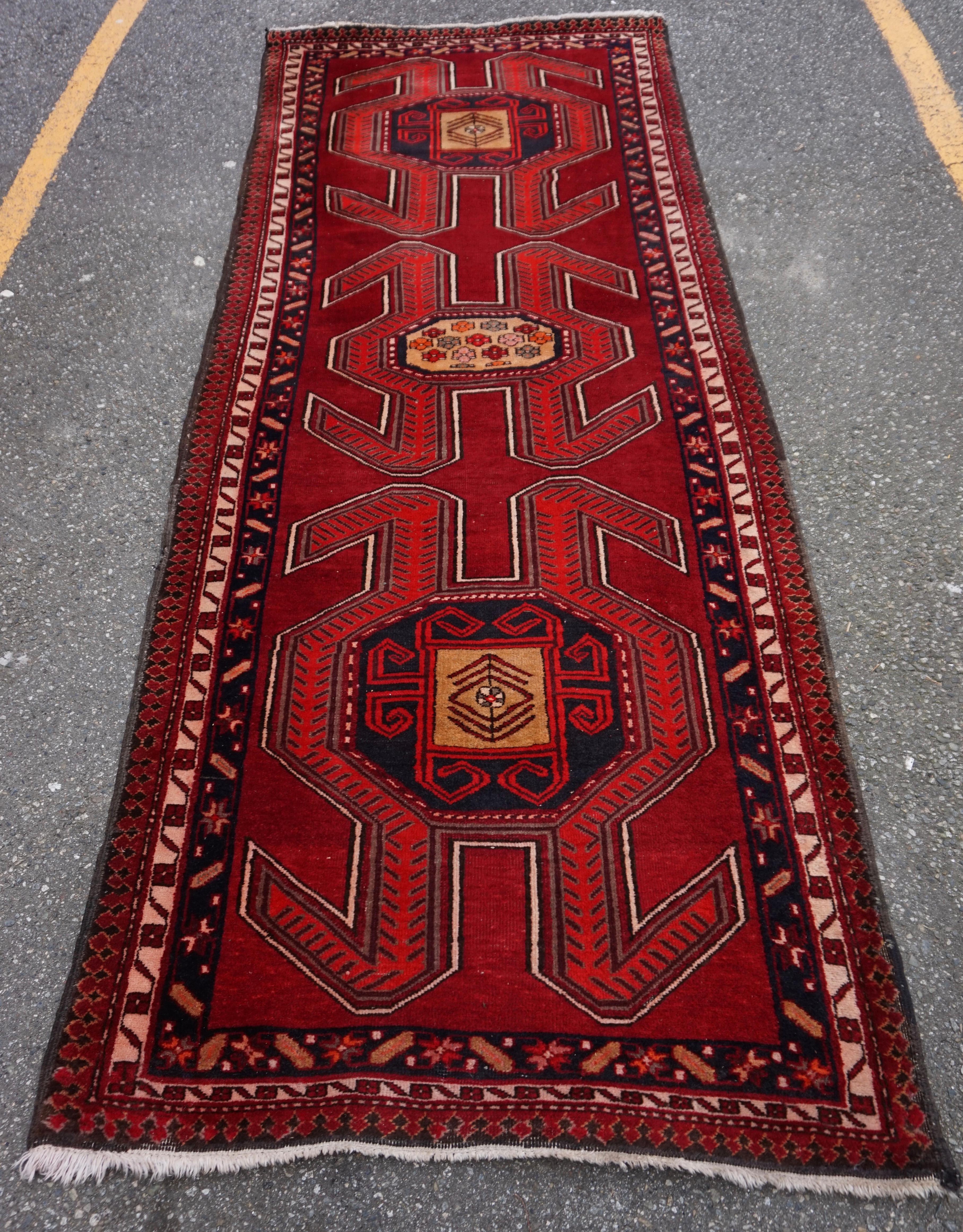 Circa 1940's 

Older Caucasus Tribal runner with vivid hues of reds and rusts. Overall good condition with minor wear near edges as shown. This rug is vibrant and has flaming shades and bold design and much life to offer.