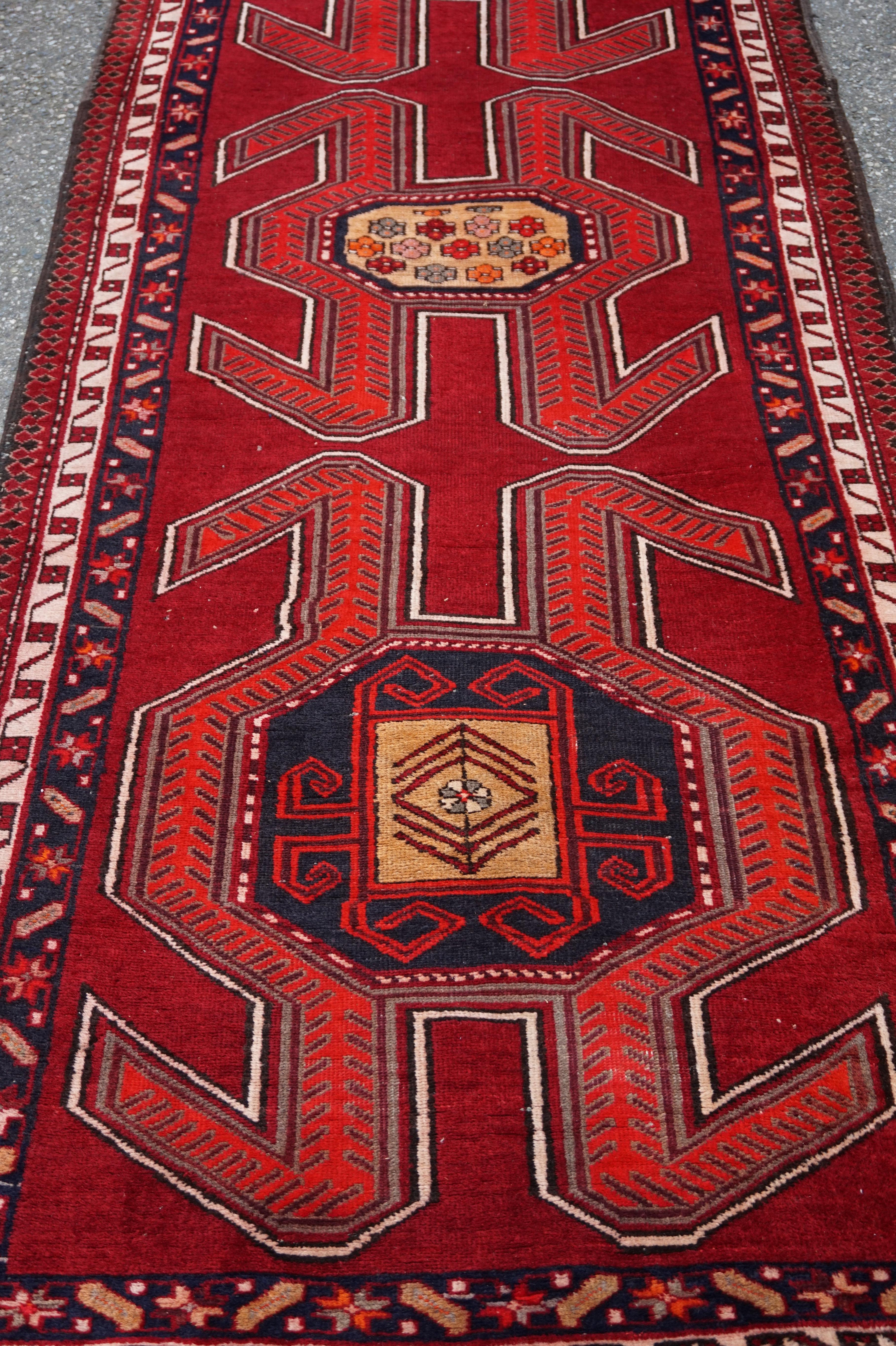 Hand-Knotted Hand Knotted Caucasus Tribal Runner Bold Symbolism & Vibrant Colours For Sale