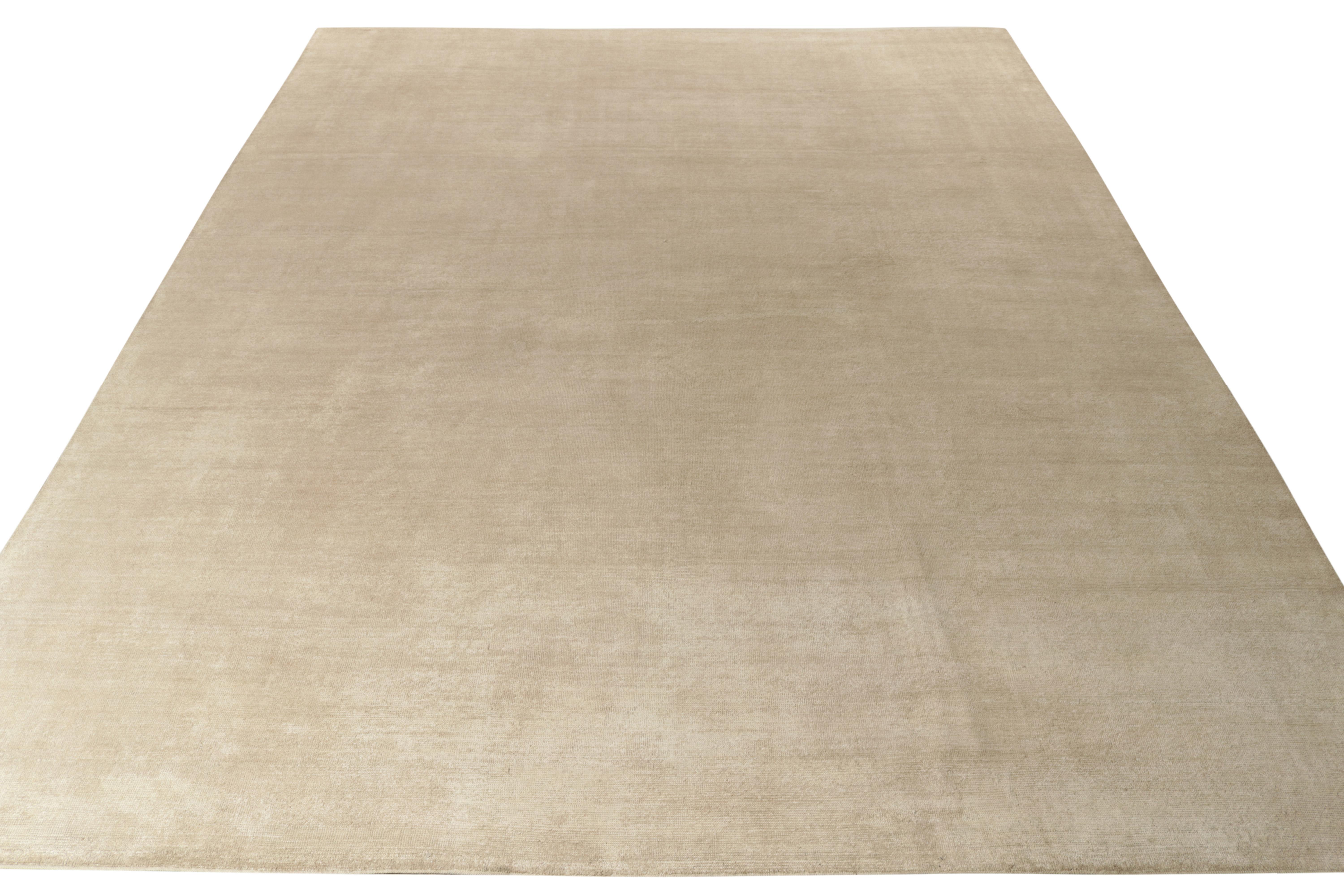 Joining Rug & Kilim’s Texture of Color collection, this 13x16 solid rug design is hand-knotted in a gracious size, enjoying a smart, abrashed look exemplifying this line. This custom rug design draws finesse from the marriage of luscious beige cream