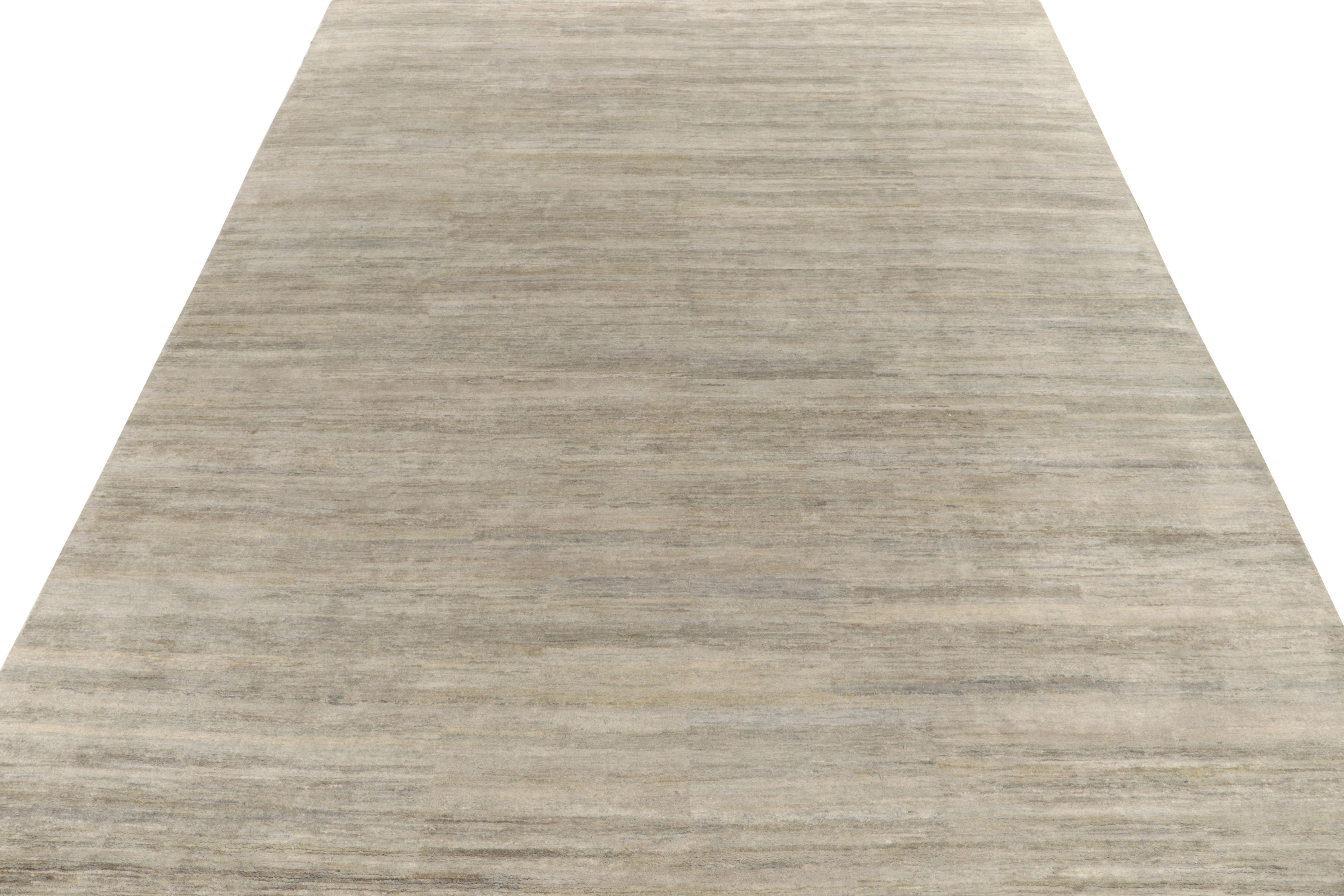 Rug & Kilim introduces its refined take on modern aesthetics with this smart, solid gray rug in a 12×15 rug from our Texture of Color collection. The contemporary piece relishes a mature colorway of silver-gray, light blue & beige-brown