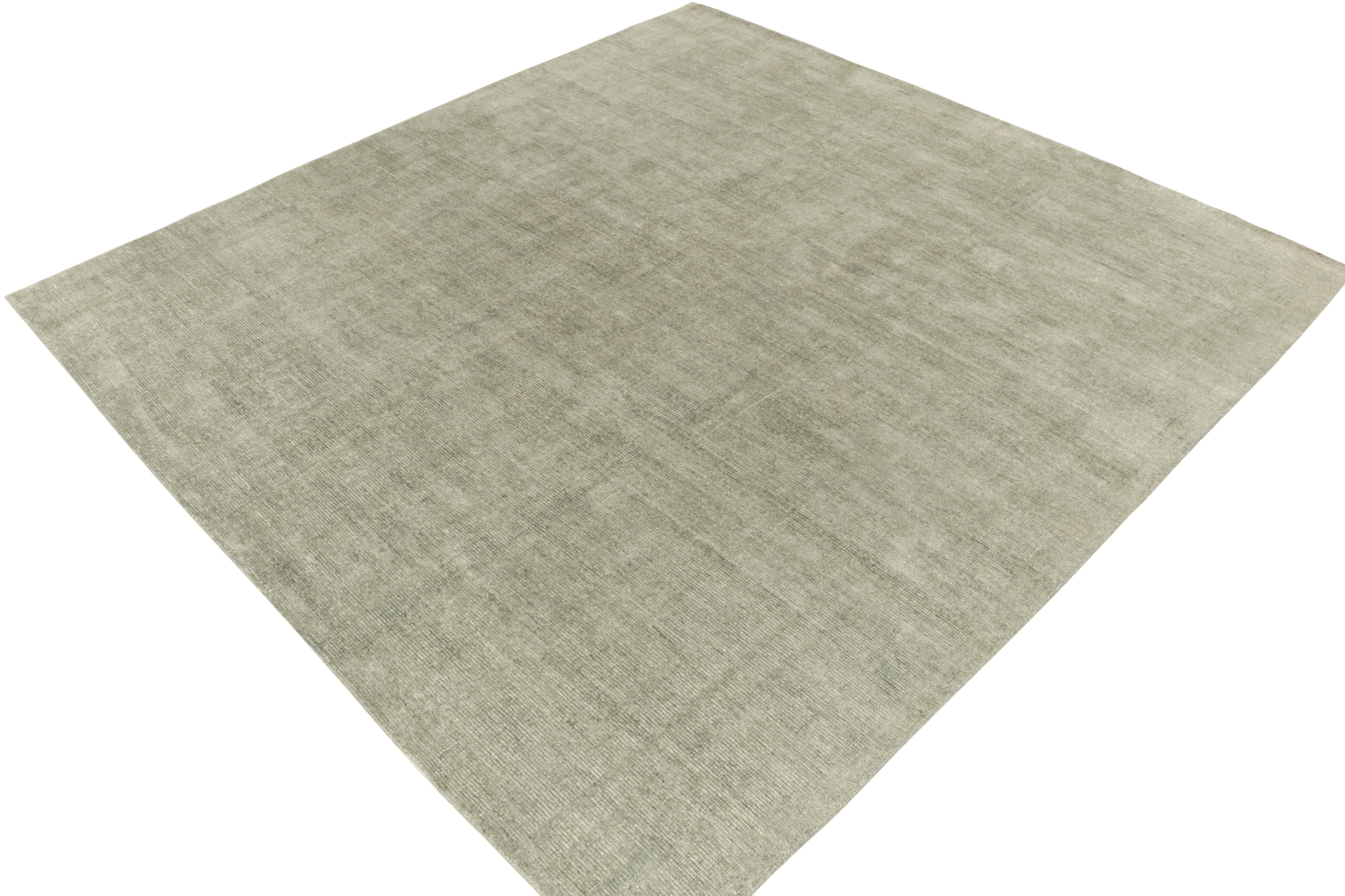 An 11x12 rug from Rug & Kilim’s contemporary Texture of Color collection. The carpet enjoys an alluring personality with light gray hues relishing pale green tones for a delicious take on colorplay. Hand-knotted in all silk with an intricate blend