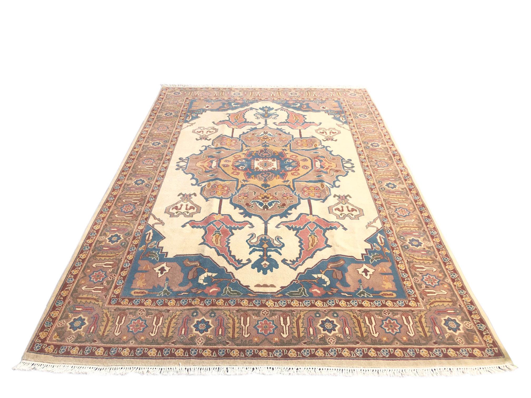 Hand knotted Chinese rug with wool pile and cotton foundation. The design of this piece has been inspired by well-known Persian Heriz rug design which is famous among designer because of the soft colors, center medallion and geometric pattern. This