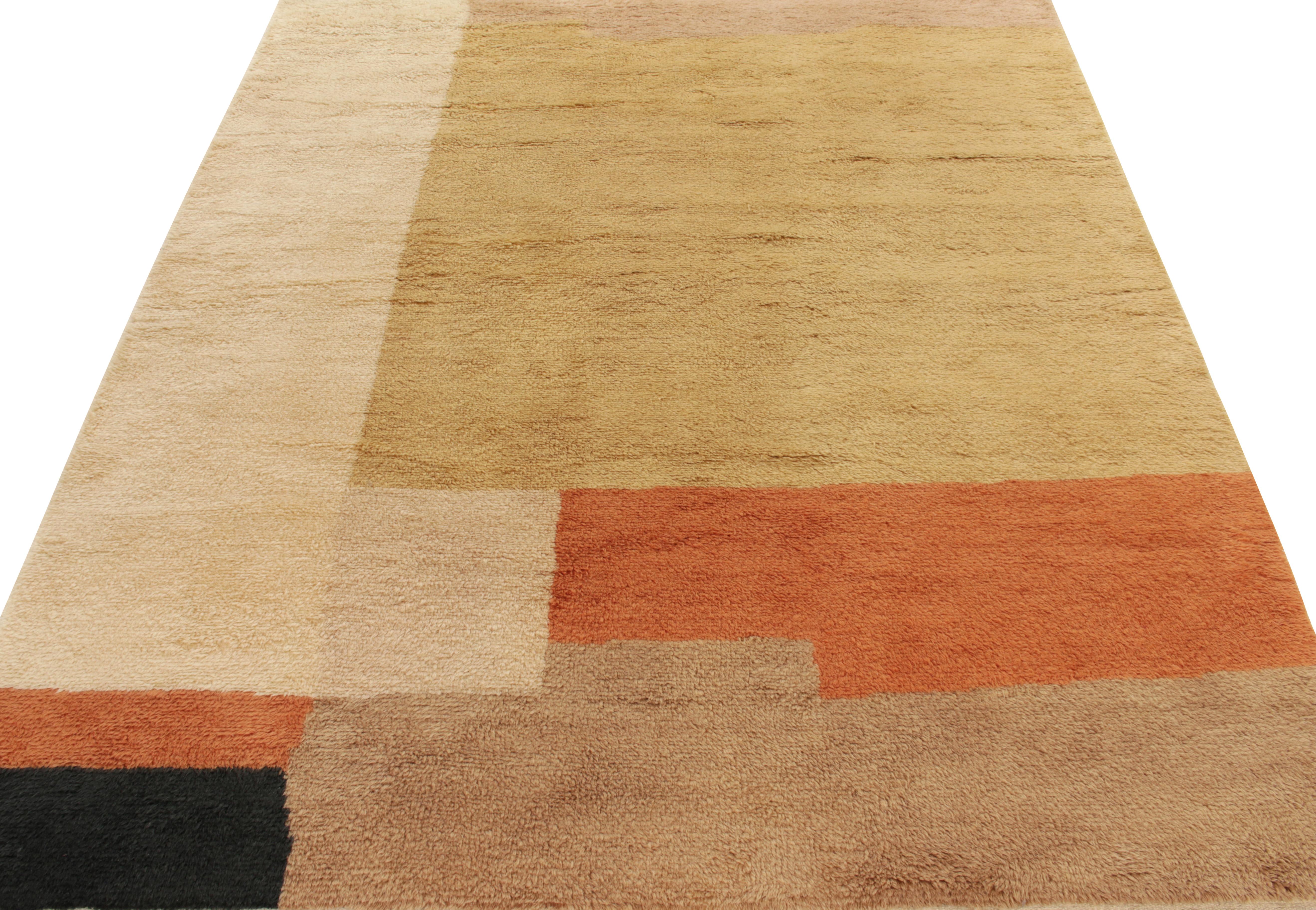 Hand-knotted in wool, an art deco custom rug design from the works of Rug & Kilim Lead Designer Nikita Nagpal—showcasing a reinvented textile design inspiration in luxurious colorways of cream, tangerine & gold for a delicious array of