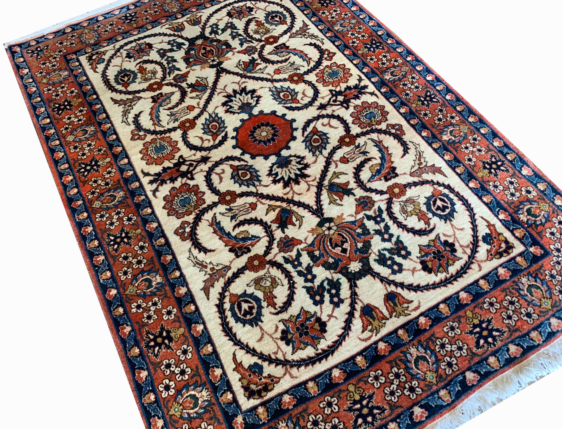 A highly decorative floral design has been woven in blue, rust, beige and brown accents on a subtle cream background. Symmetrically designed with a bold rust background border. The sophistication in the design and weaving makes it the perfect accent