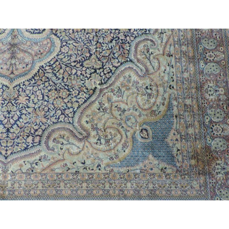 Hand knotted Indian Amritsar carpet with a soft colour palette, about 10 years old. This is an outstanding carpet of recent production with a traditional large medallion design in soft pastel colours. A superb decorative carpet that will look at