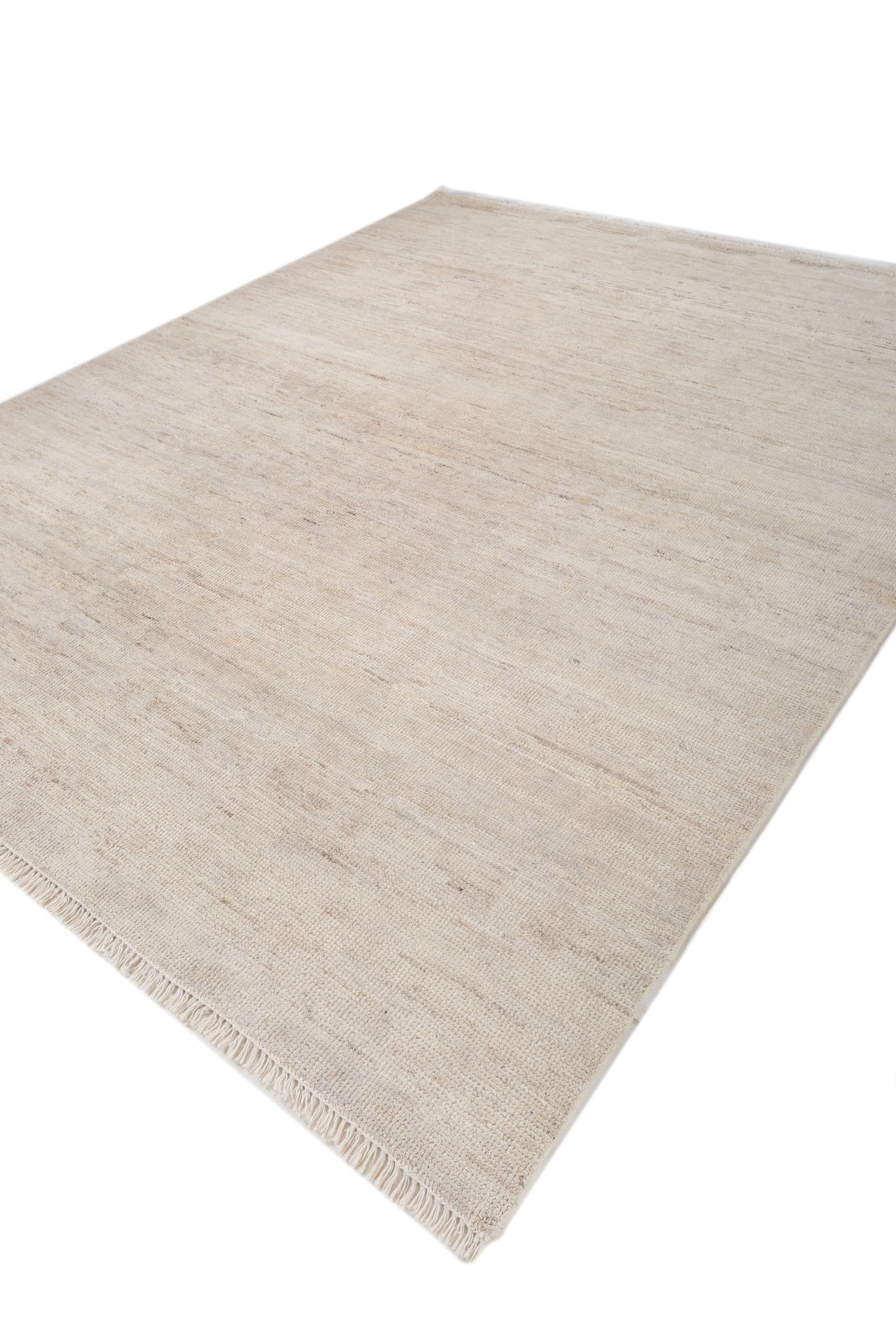 Schaffen Sie ein ruhiges Ambiente mit diesem 8' x 10' großen handgeknüpften Jaipur-Teppich in einem beruhigenden wolkenweißen Farbton. Dieser Teppich aus hochwertiger Wolle zeichnet sich durch ein subtiles, strukturiertes Muster aus, das