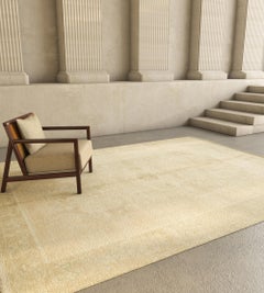 Tappeto in lana Jaipur annodato a mano in un lussuoso color oro, con un design solido ed elegante.