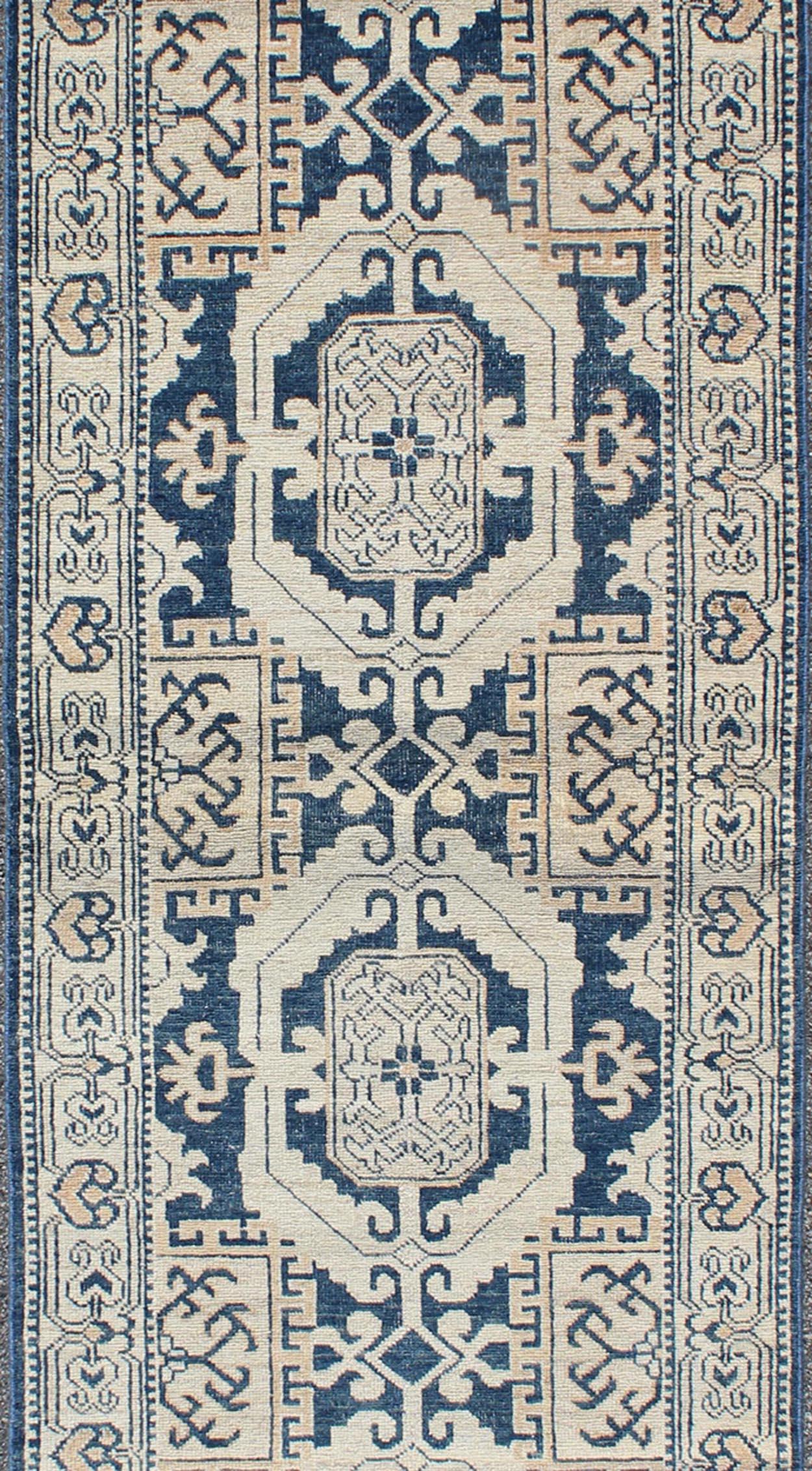 Khotan with Geometric Medallions, Keivan Woven Arts rug MP-1310-93, country of origin / type: Afghanistan / Khotan, circa Early-21st Century.

Measures: 2'11 x 10'3.

This Khotan features a geometric multi-medallion design flanked by a repeating