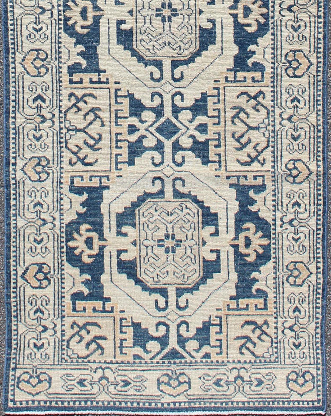 Afghan Hand Knotted Khotan Runner with Geometric Medallions in Navy and Cream Tones For Sale