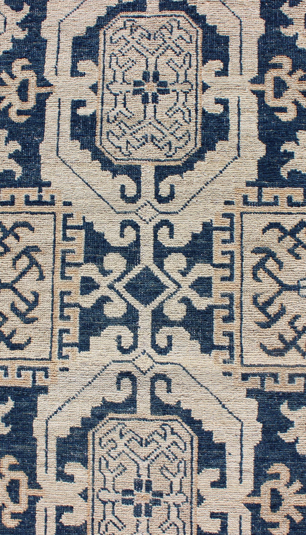 Hand Knotted Khotan Runner with Geometric Medallions in Navy and Cream Tones In Excellent Condition For Sale In Atlanta, GA