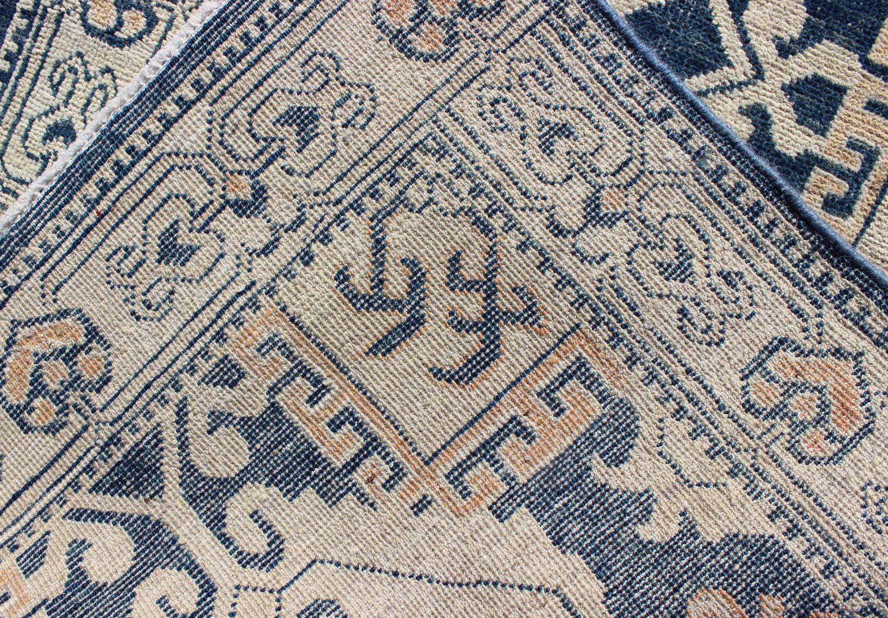 Wool Hand Knotted Khotan Runner with Geometric Medallions in Navy and Cream Tones For Sale