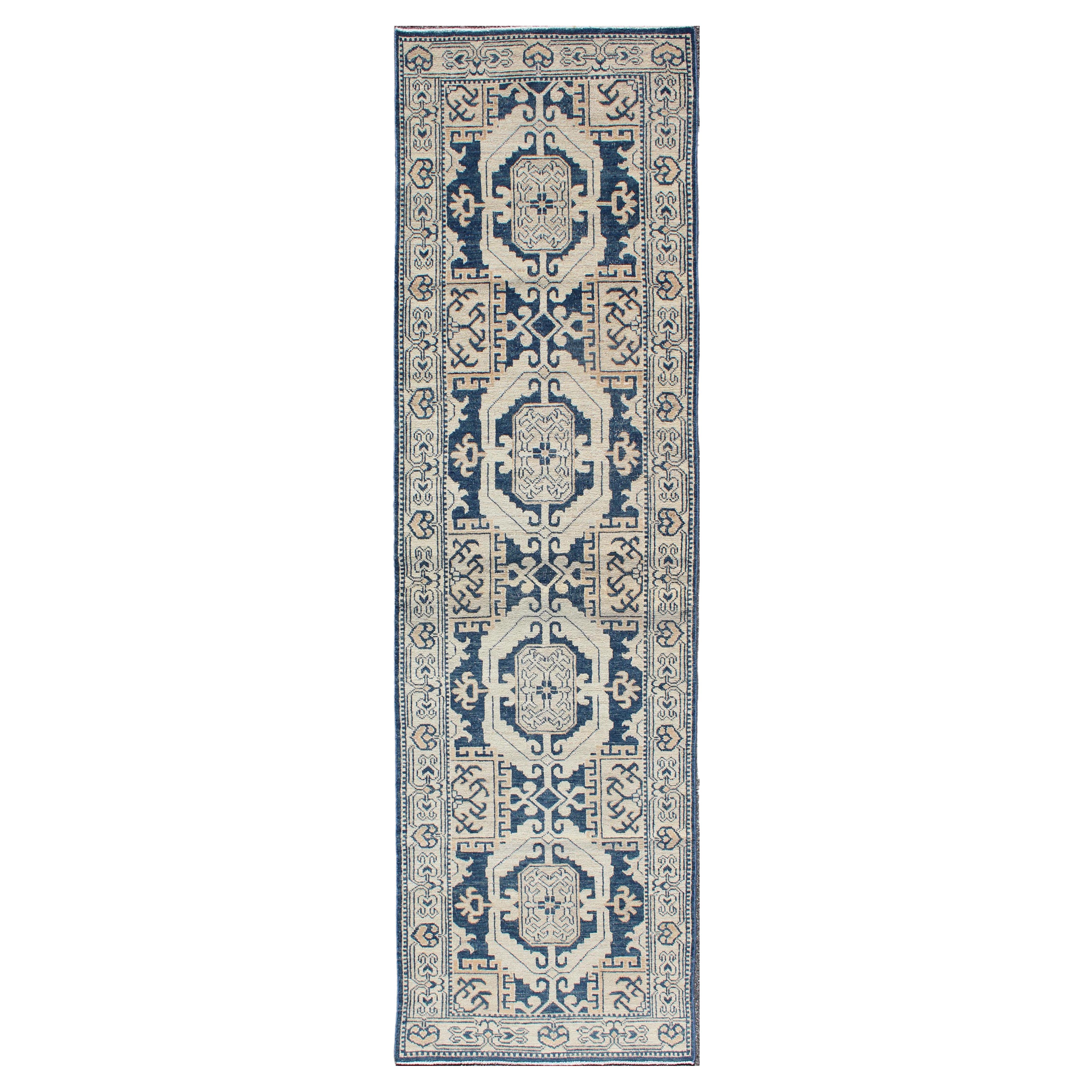 Hand Knotted Khotan Runner with Geometric Medallions in Navy and Cream Tones For Sale