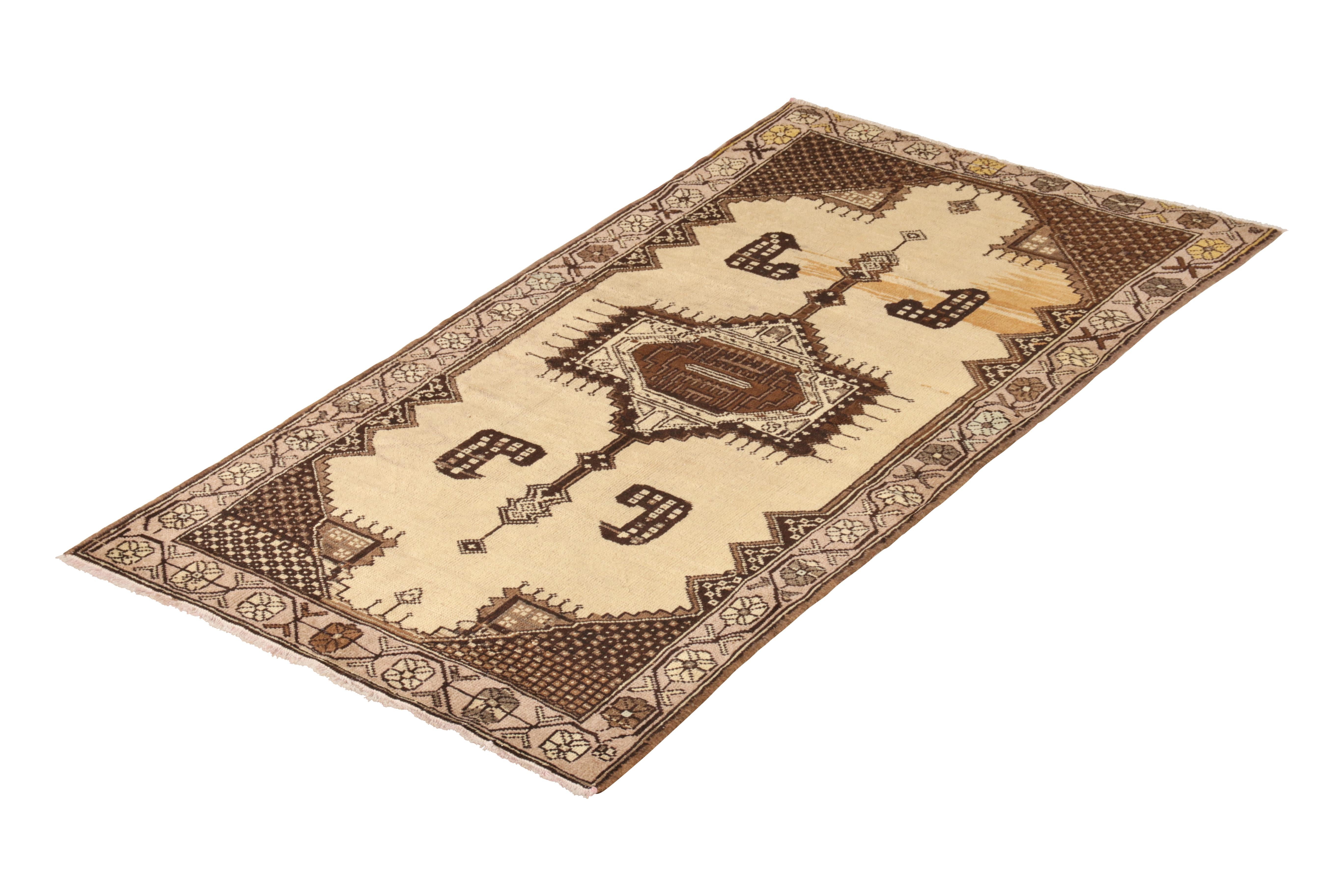 Hand knotted in wool originating from Turkey circa 1950-1960, this vintage Oushak rug connotes a distinguished mid-century runner in a dually appealing gift-sized 3 x 6 size, well-suited in dimensions and sensibility to a wide array of projects