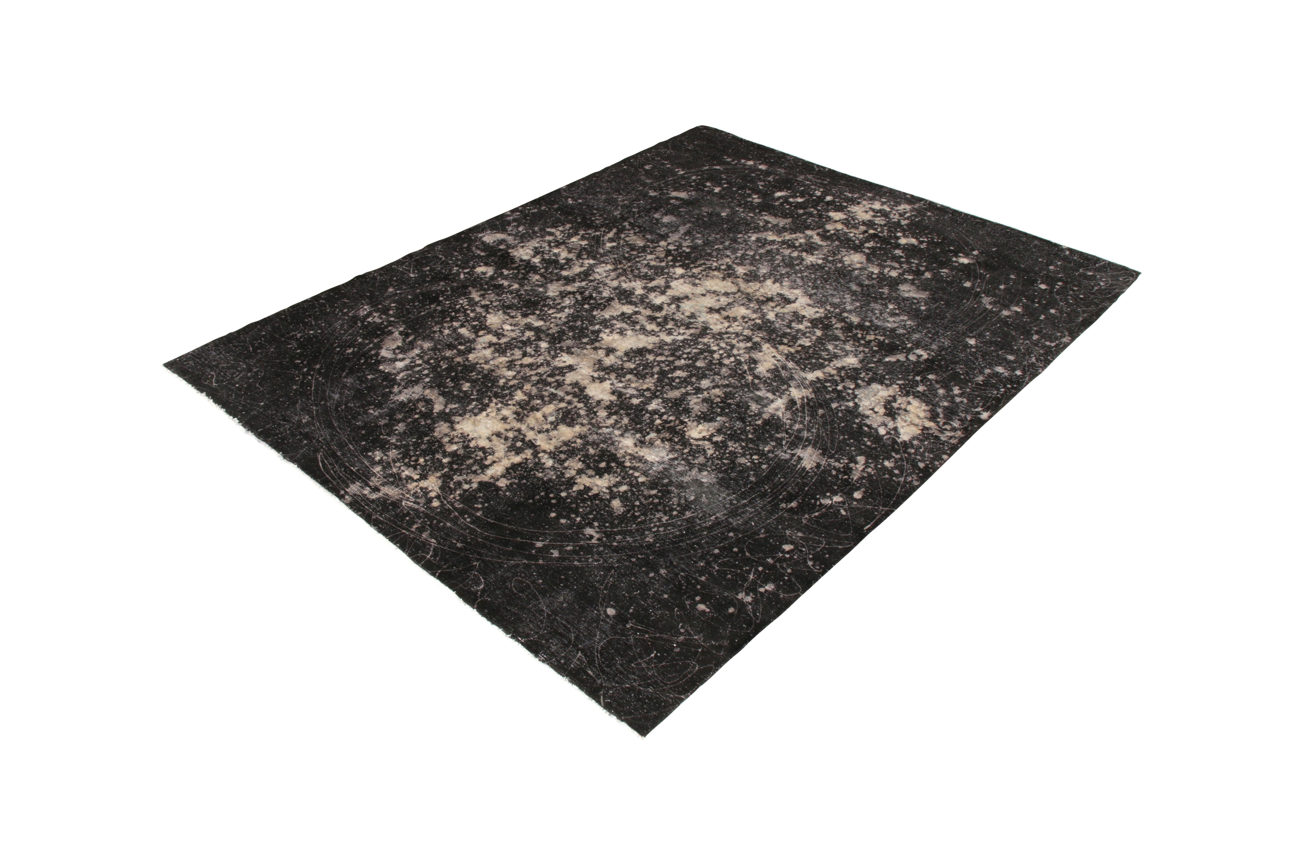 From Rug & Kilim’s New & Modern rug collection, a 10x12 abstract rug of a very rare dye originating from a celebrated atelier in Turkey. Joining our Milky Way line, the positive-negative play of black and white mingles with a painterly play of