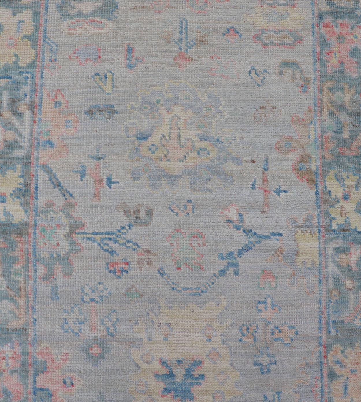 Measures: 2'5 x 9'10 
Hand-Knotted Modern Oushak Runner on Light Gray Field and Colorful Motifs. Keivan Woven Arts; rug AWR-12648 Country of Origin: Afghanistan Type: Oushak Design: Floral, All-Over, Arabesque 21st Century 

This Oushak runner has