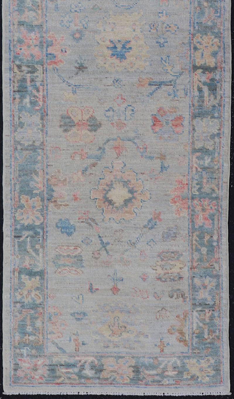 Wool Hand Knotted Modern Oushak Runner on Light Gray Field and Colorful Motifs For Sale