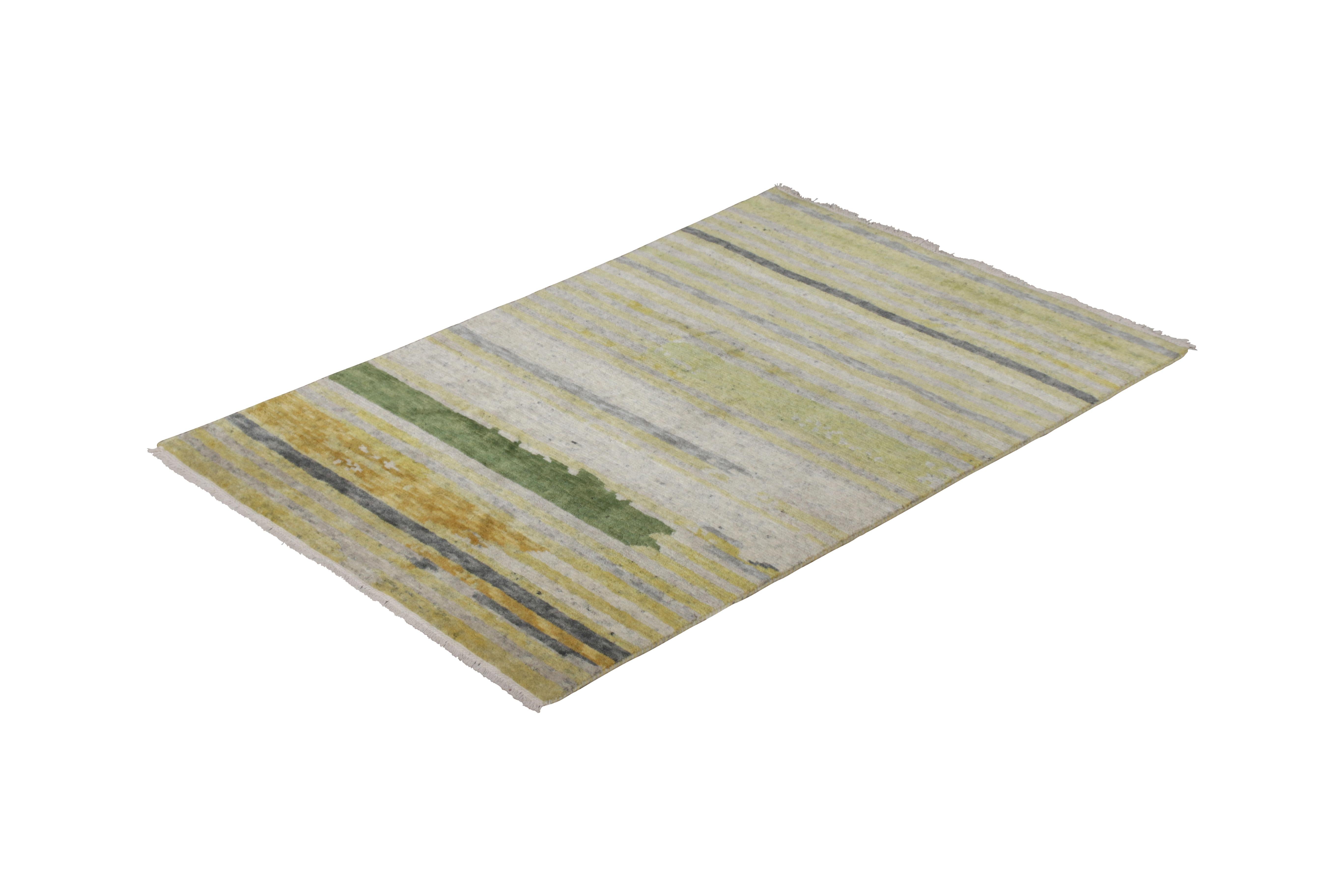 Hand knotted with a blend of quality wool, all-natural silk, and exotic yarns, this 4 x 6 modern rug joins the new and modern rug collection by Rug & Kilim, enjoying a particularly unique colorway approach to contemporary stripe patterns like this
